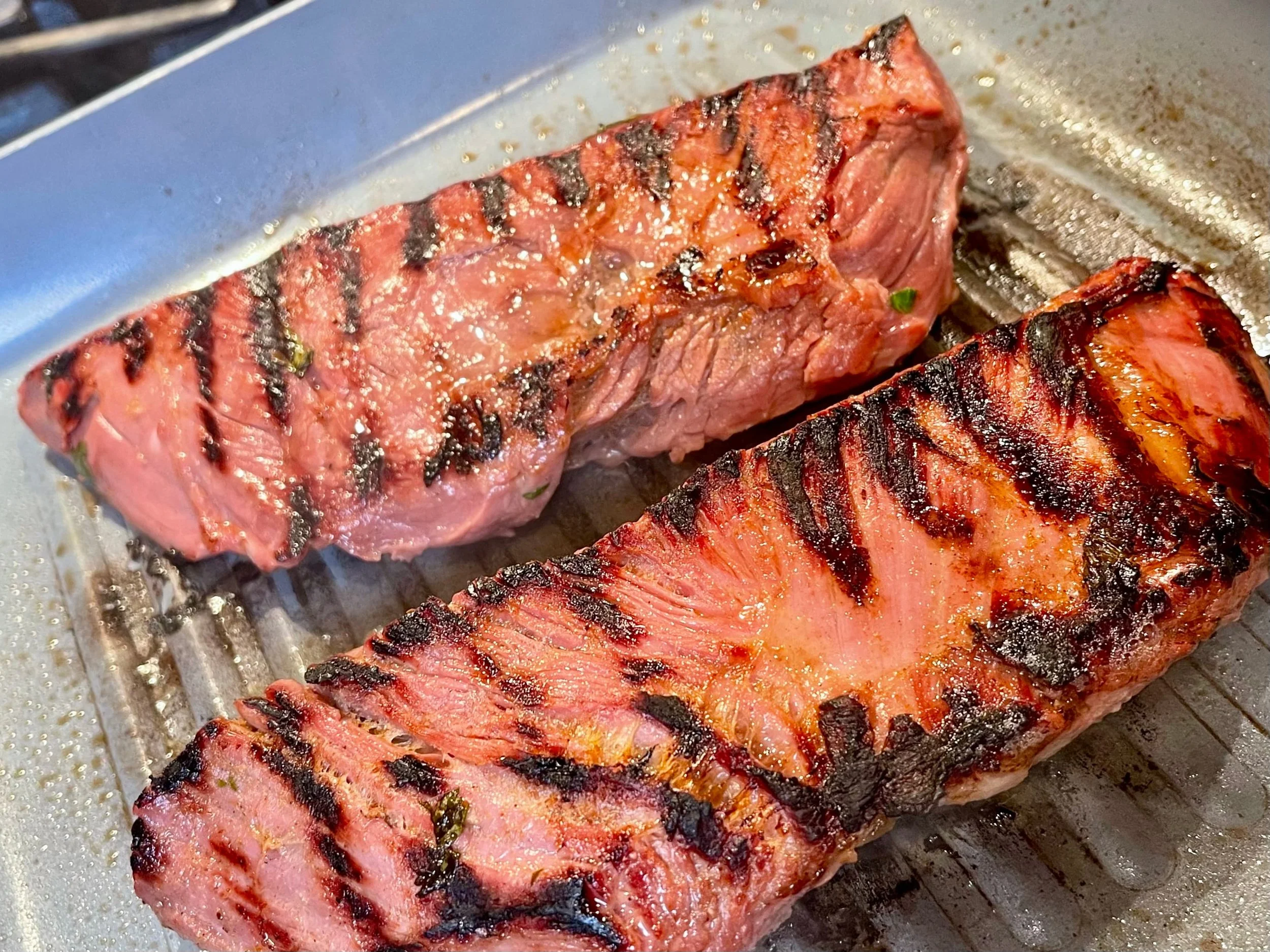 Grill marks and char on carne asada