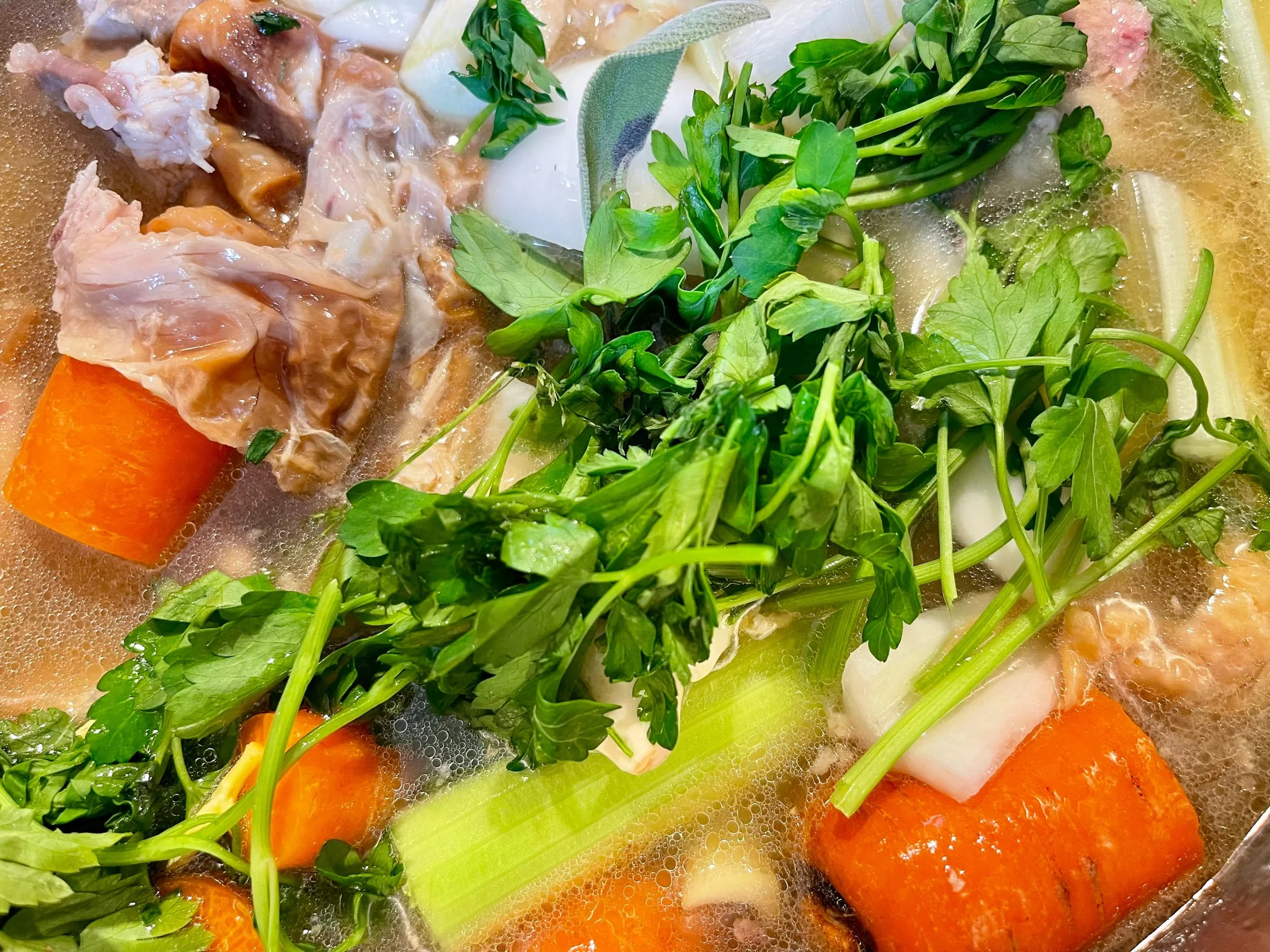 Adding the water to make chicken stock