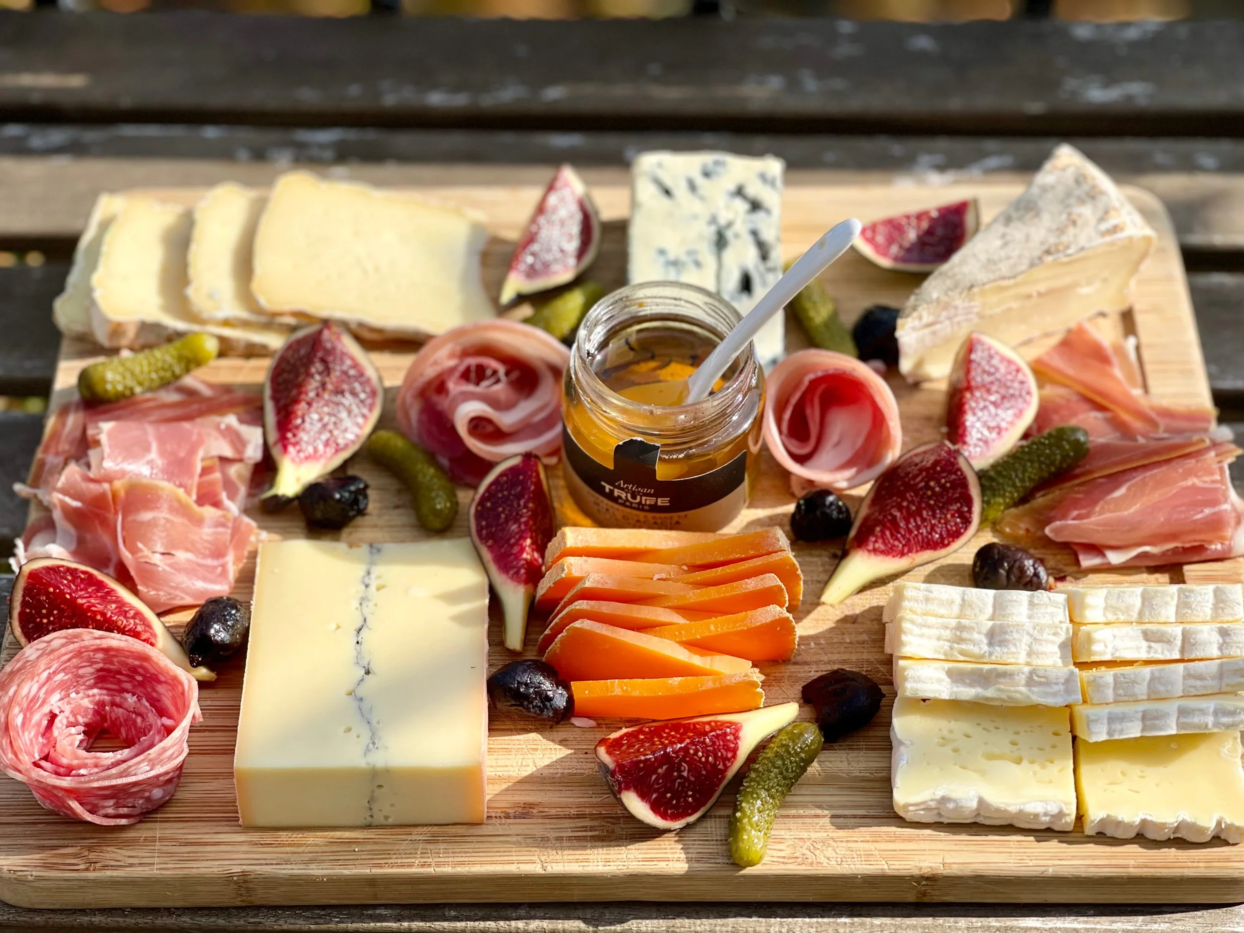 A cheese and Charcuterie board made from Farmer's market items