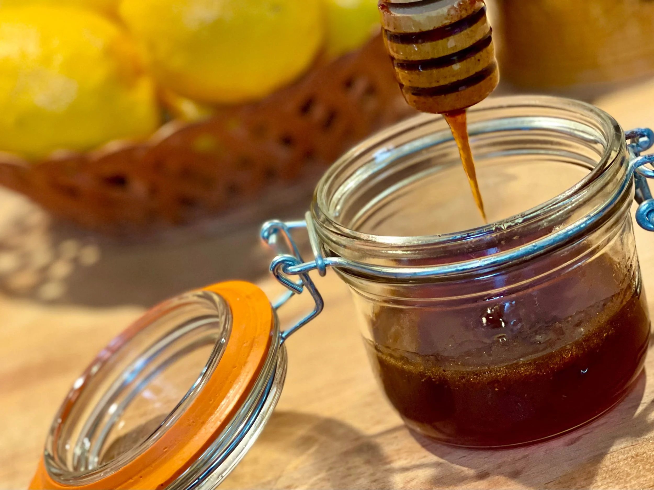 Hot Honey Sauce recipe complete and dripping on honey stick
