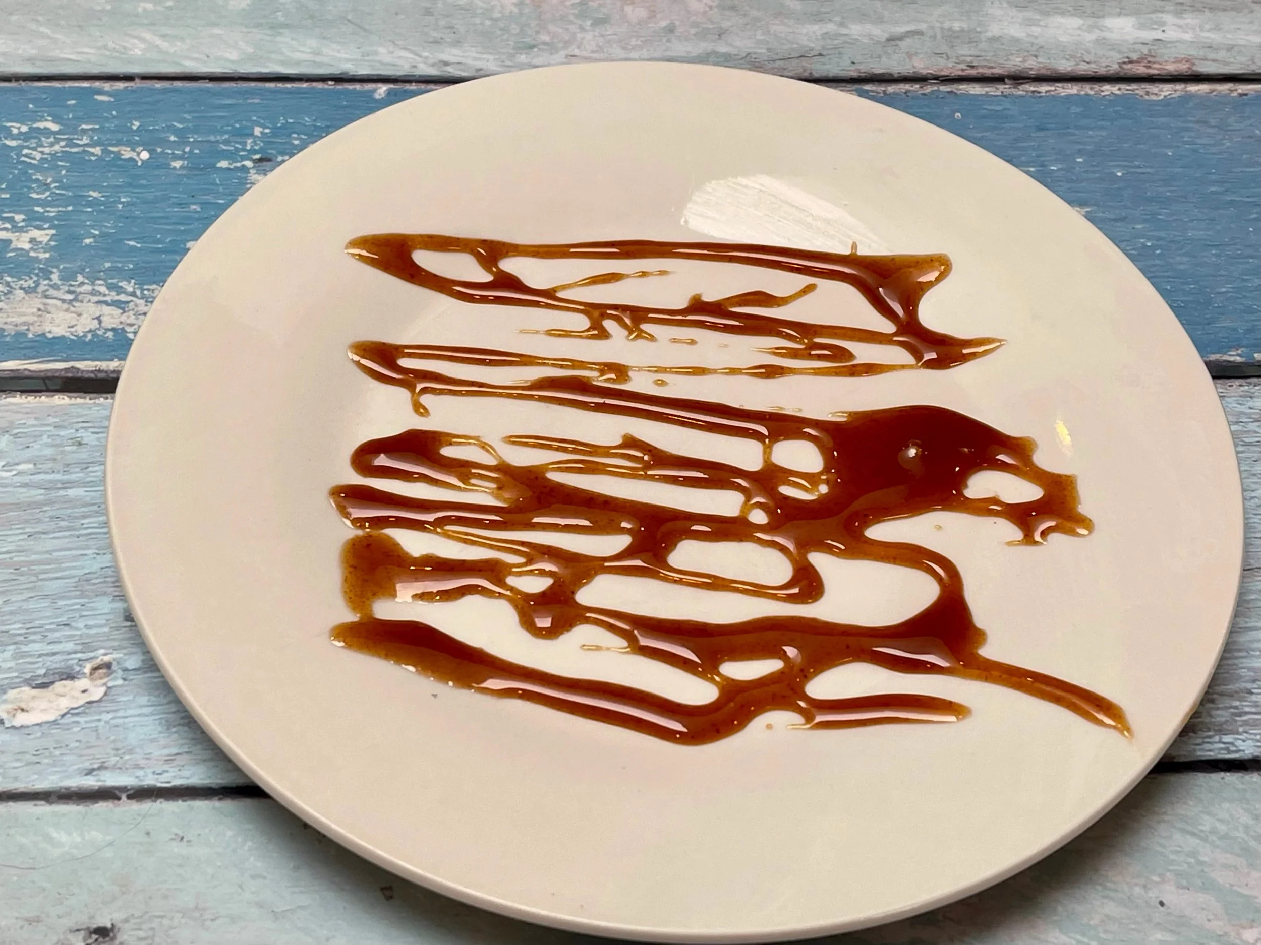 Hot honey drizzled on serving plate