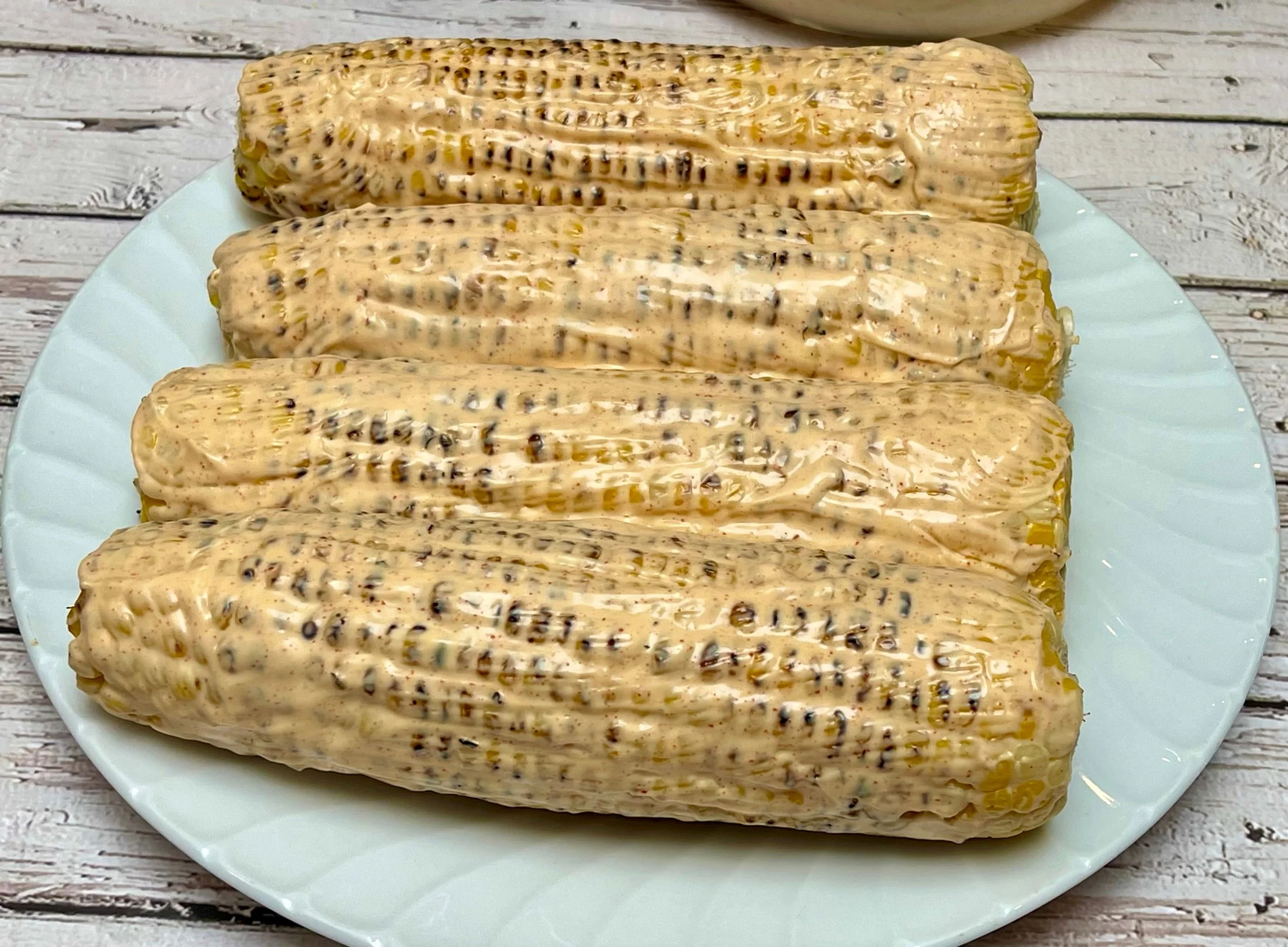 Charred corn brushed with dressing