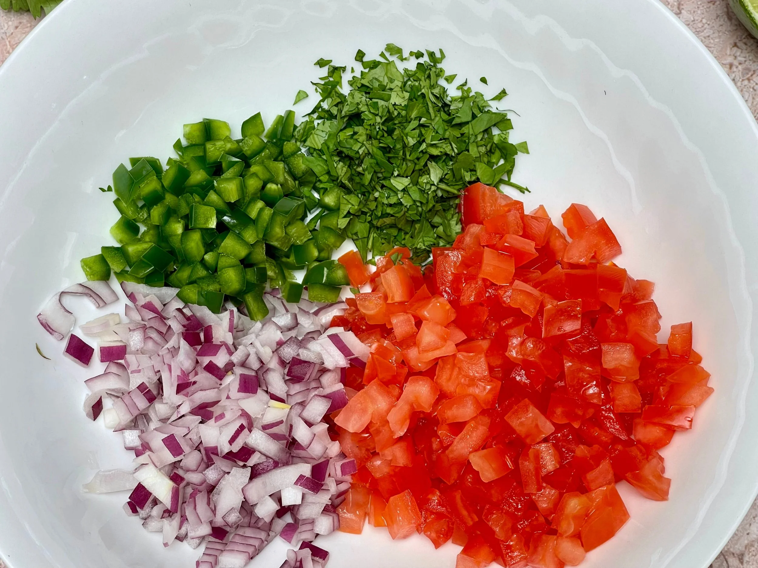 All ingredients for Pico de Gallo in a bowl
