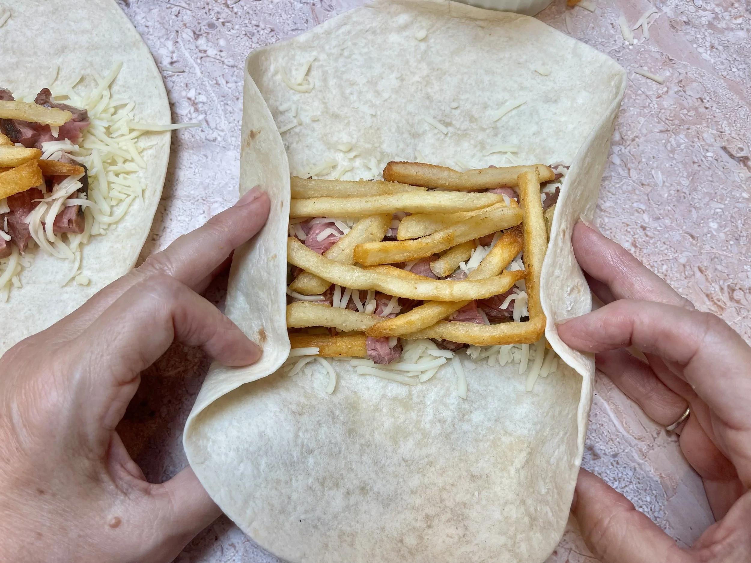 Folding in the sides of the tortilla