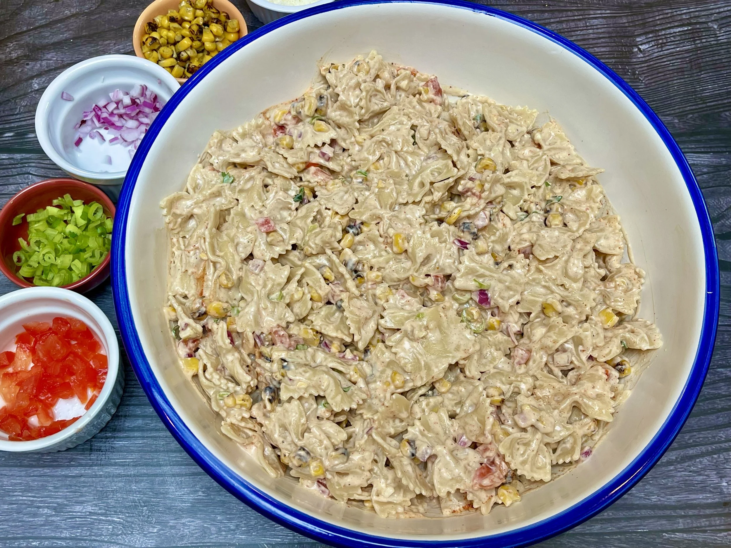 Pasta, vegetables, and dressing combined