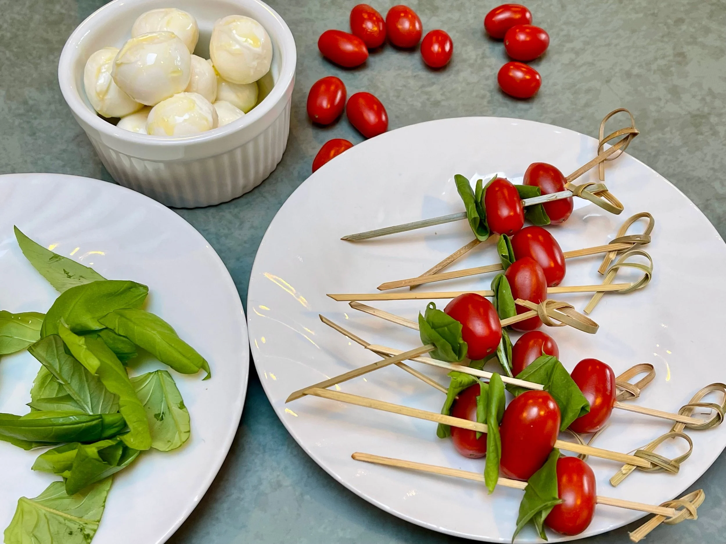 Tomatoes and basil on skewers