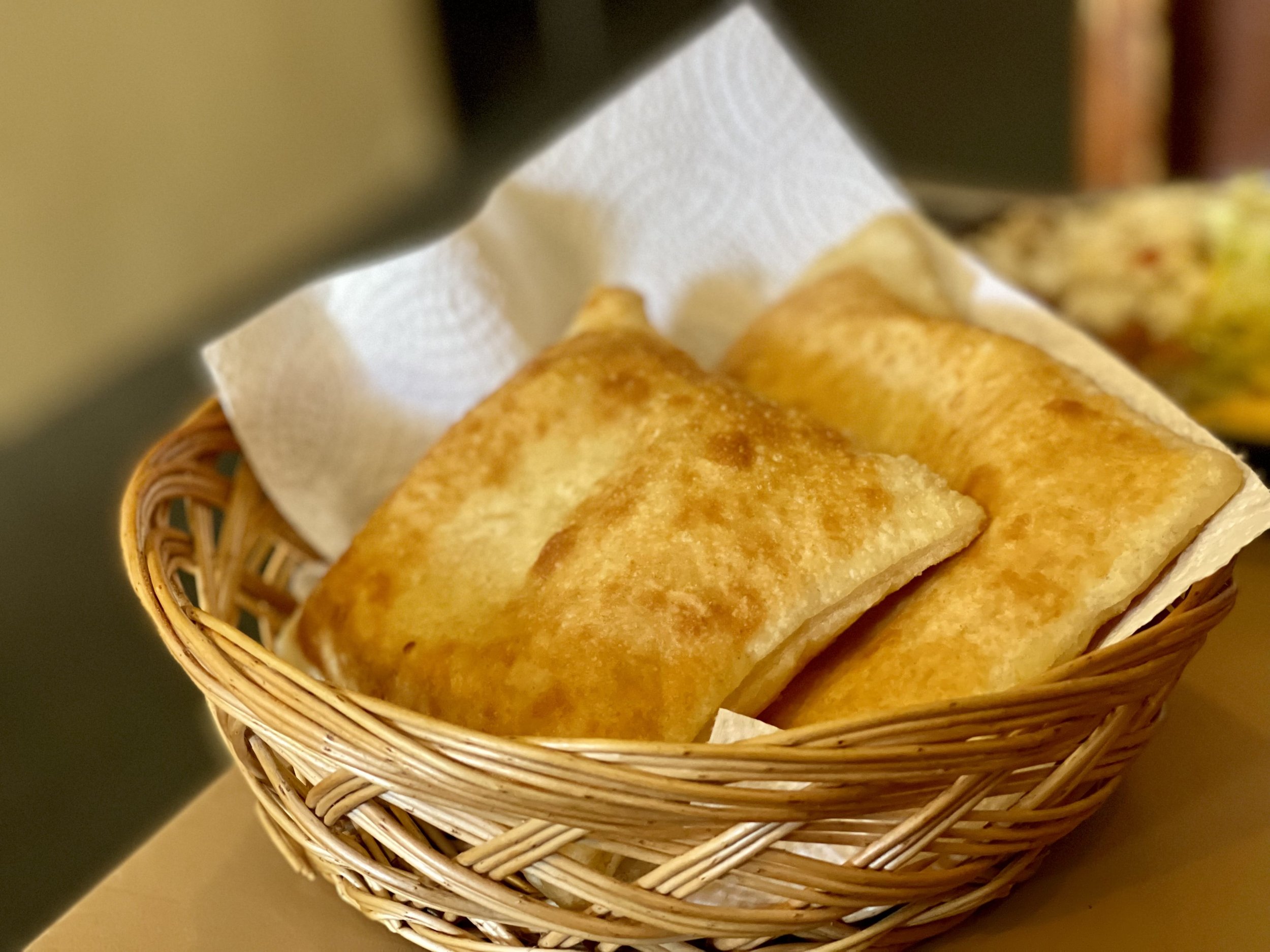 A basket of Sopaipilla at a restaurant in New Mexico.