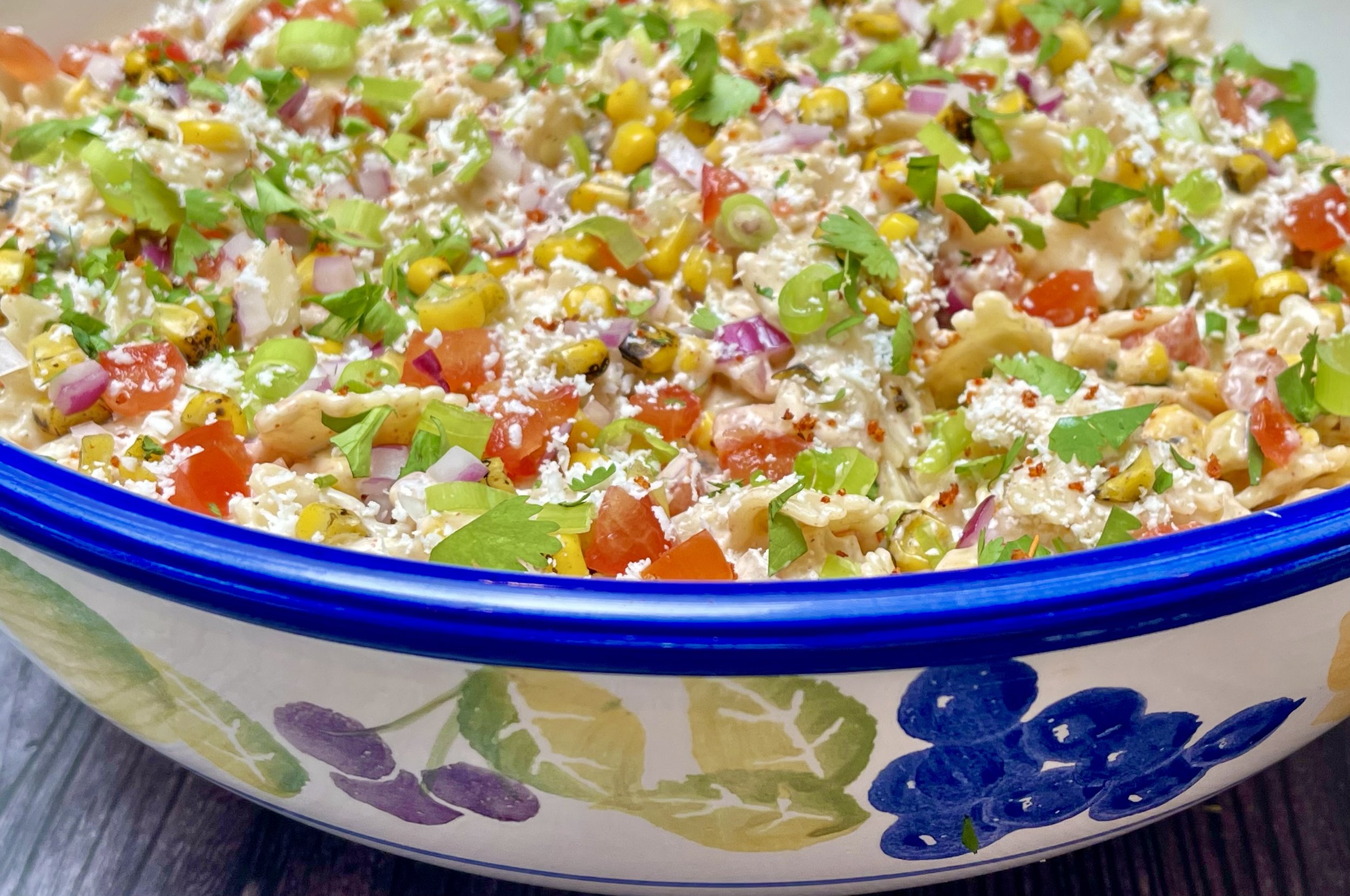 Serving bowl filled with Mexican Street Corn Pasta Salad