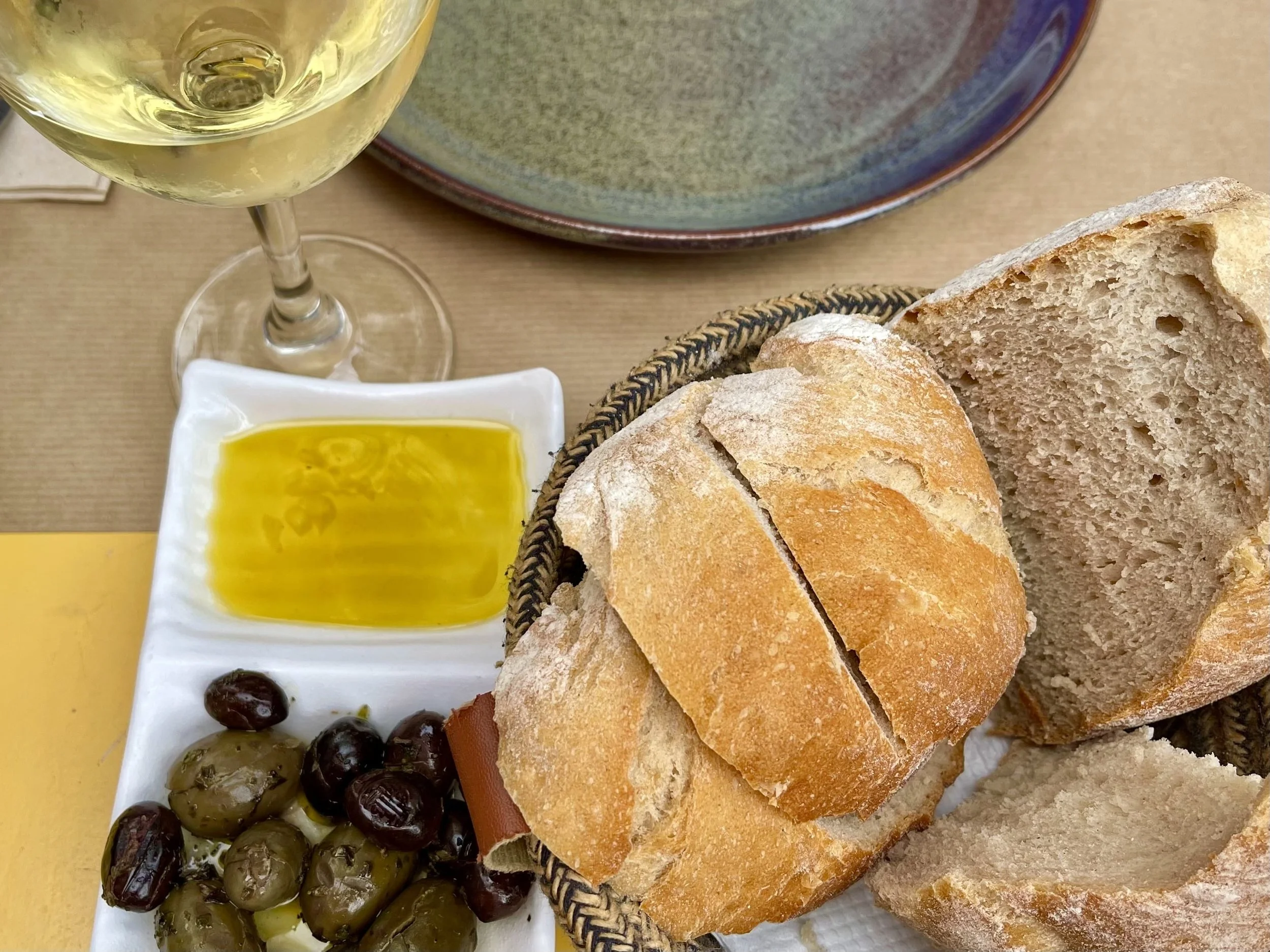 Celebrating La Vendemmia with wine, bread, olives and olive oil