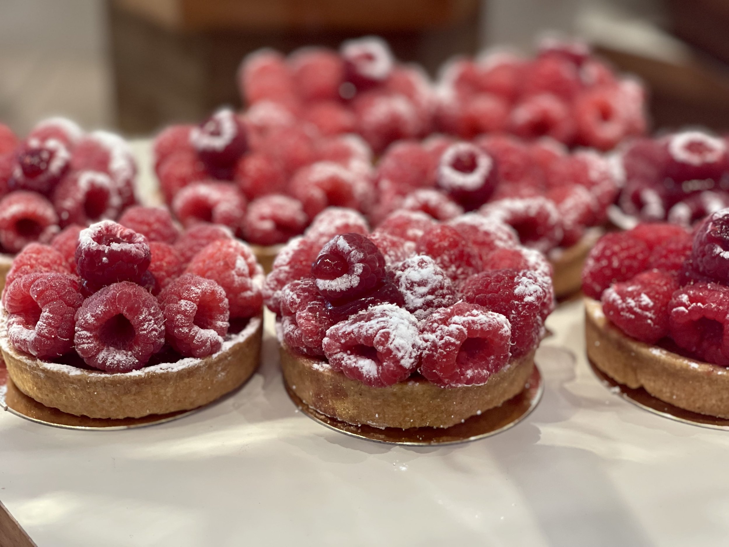 Delicious Tartes Framboises, raspberry tarts, at a Parisian  pâtisserie