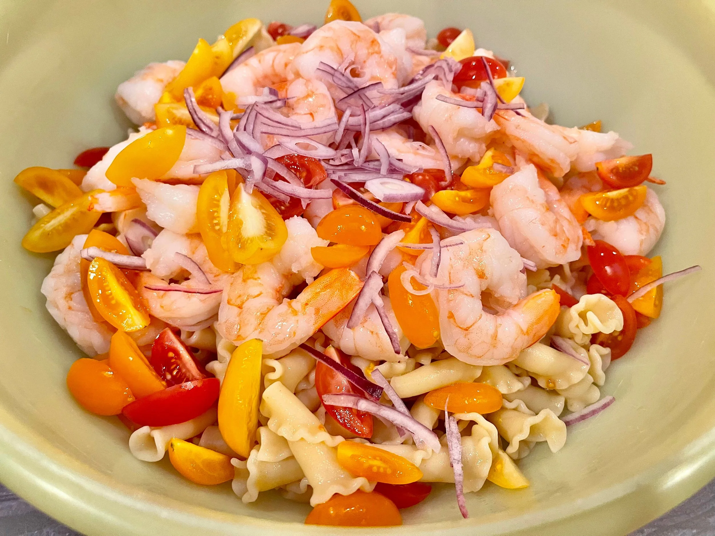 All ingredients except pesto in a bowl