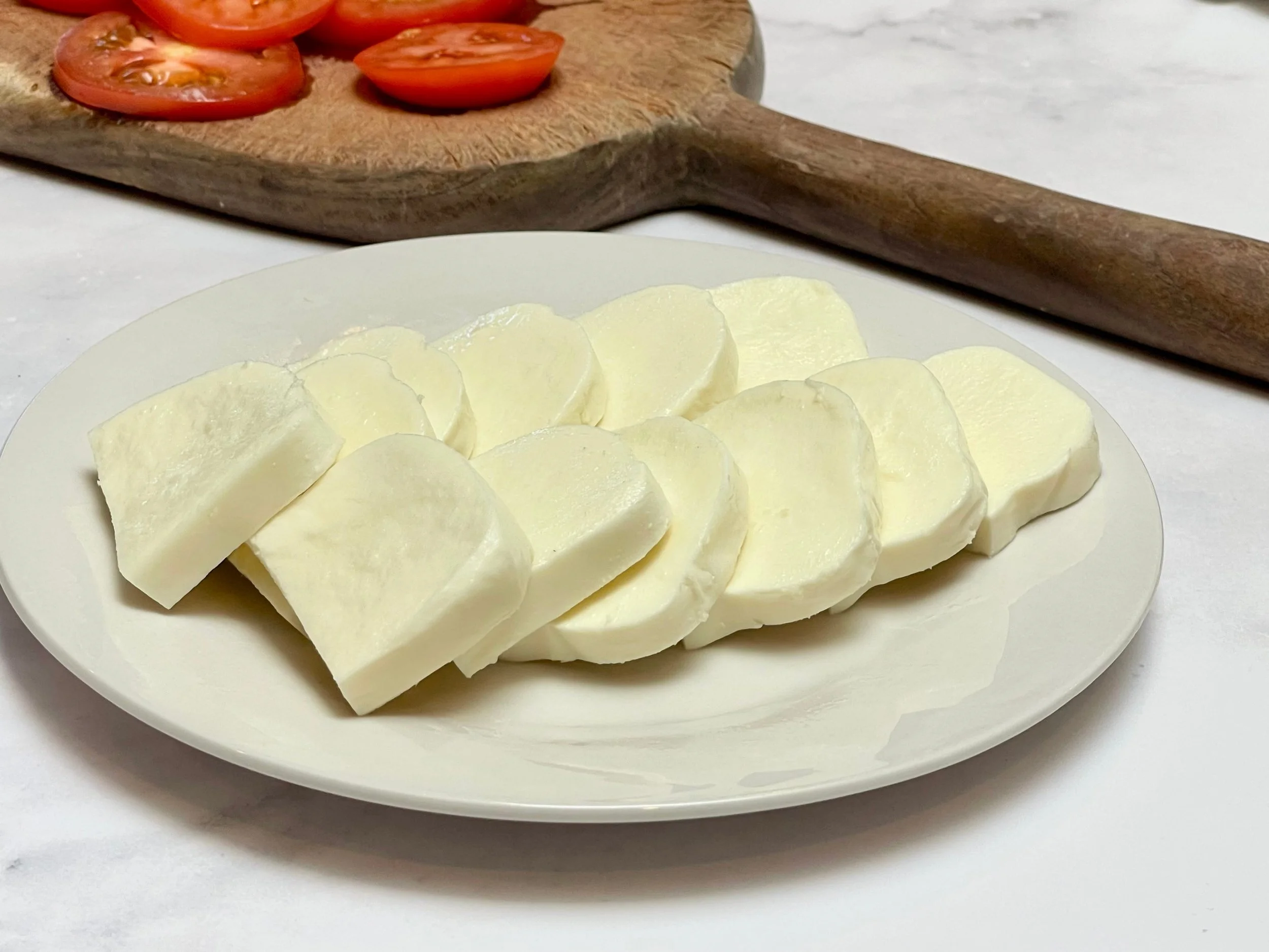 Mozzarella sliced in rounds for the salad