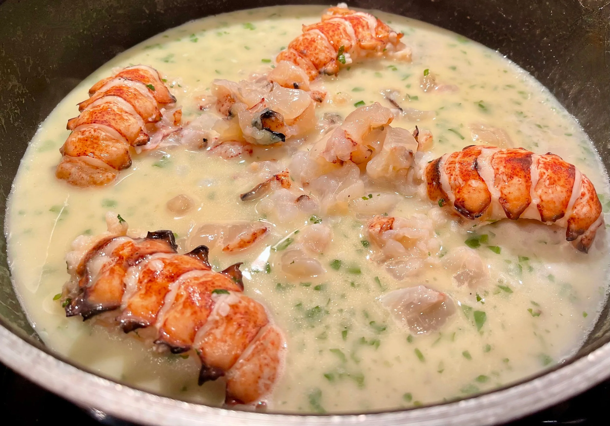 Cooking the lobster in the sauce