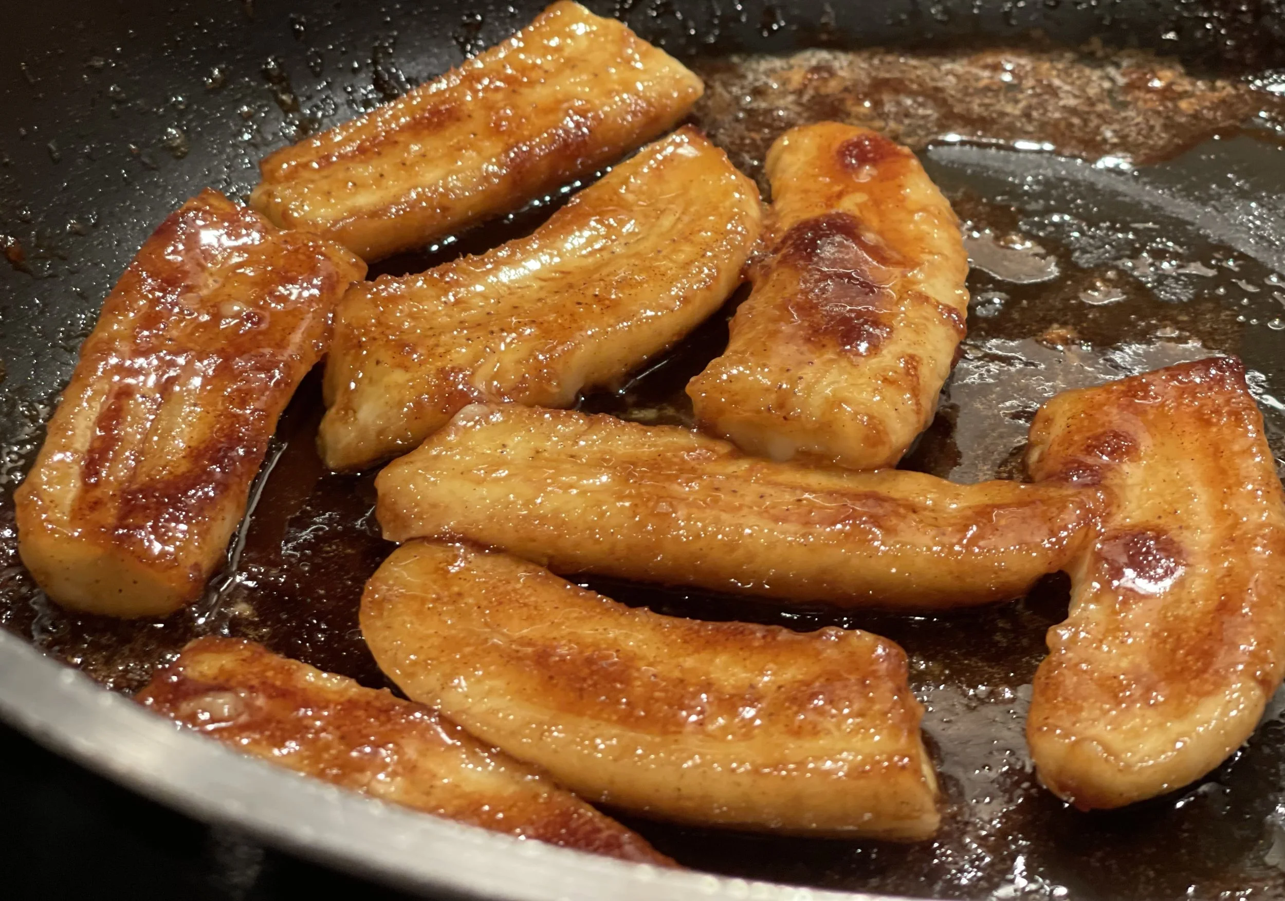 caramelizing bananas in a skillet