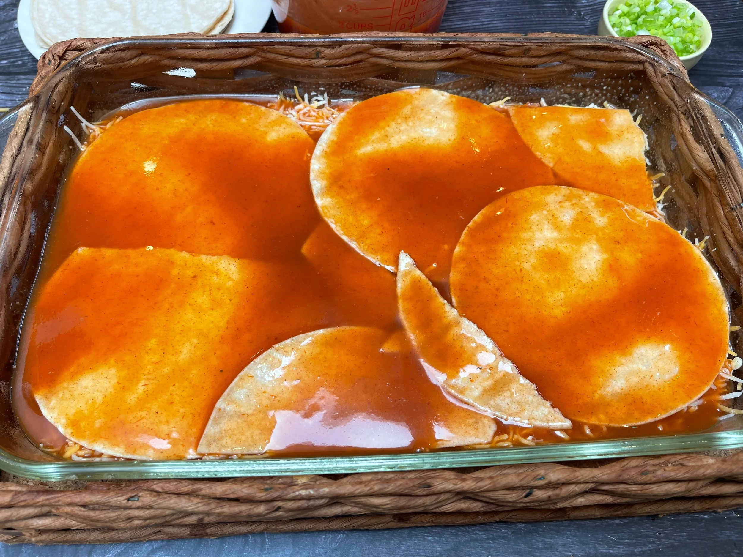 starting the next layer with enchilada sauce