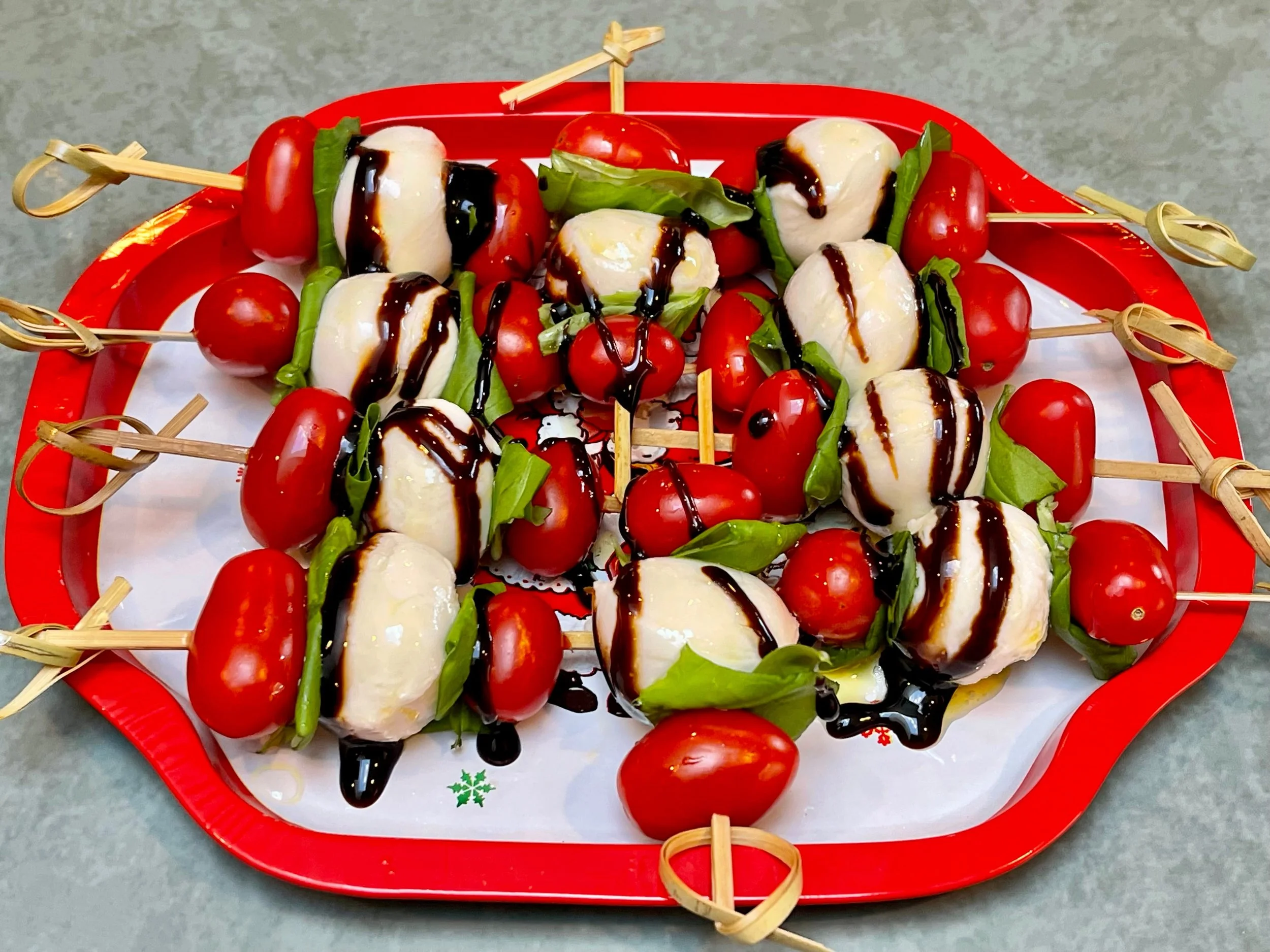 Caprese Sticks on a holiday plate