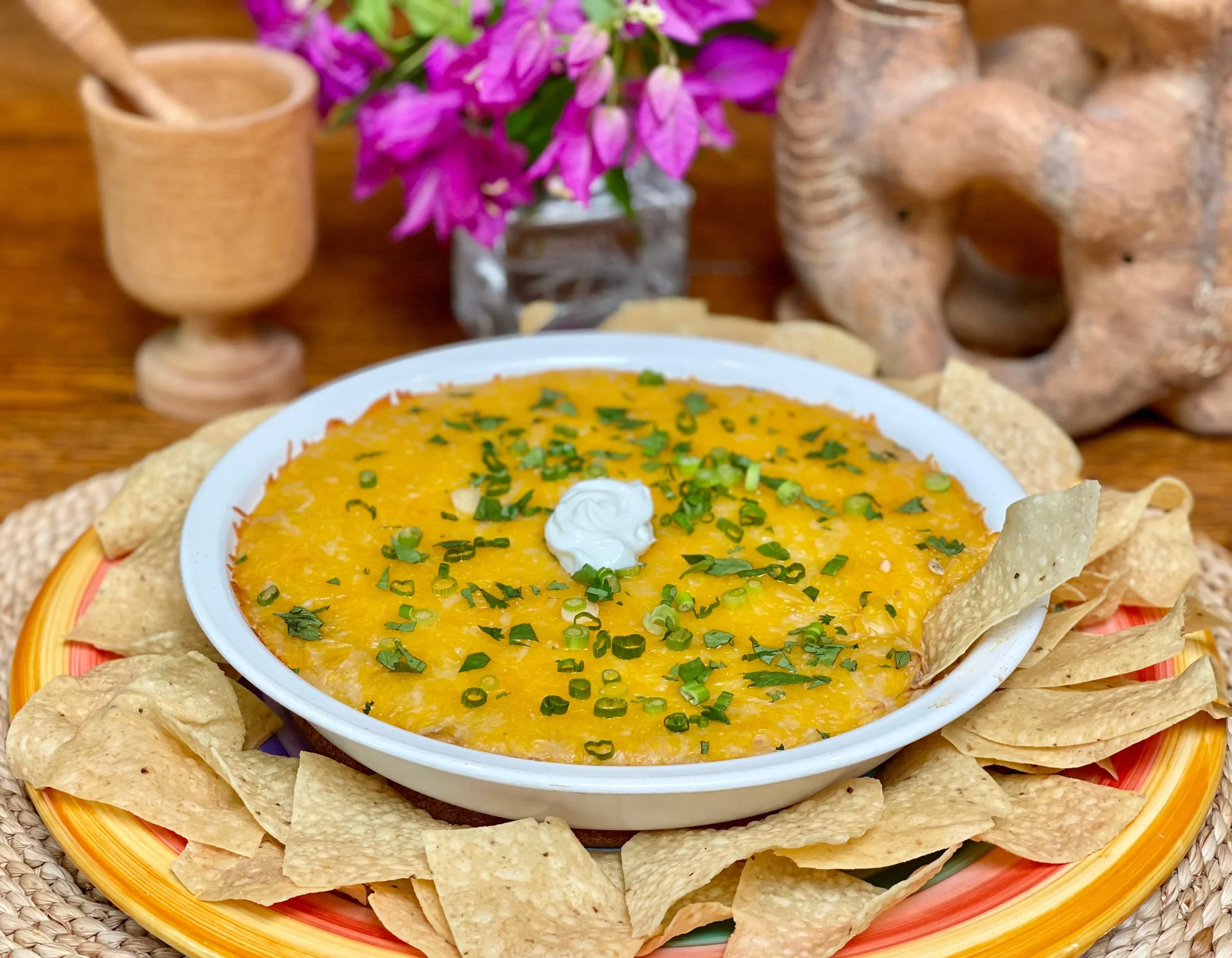Serving refried bean dip with tortilla chops