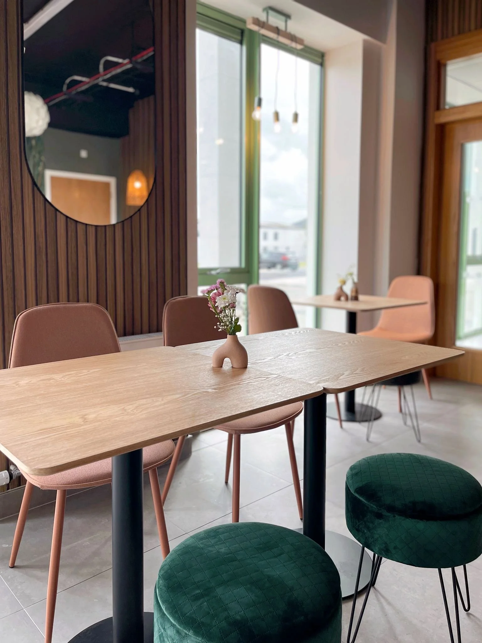 Dining area with mural backdrop, mixed seating, and a family-friendly layout designed for comfort and flow.
