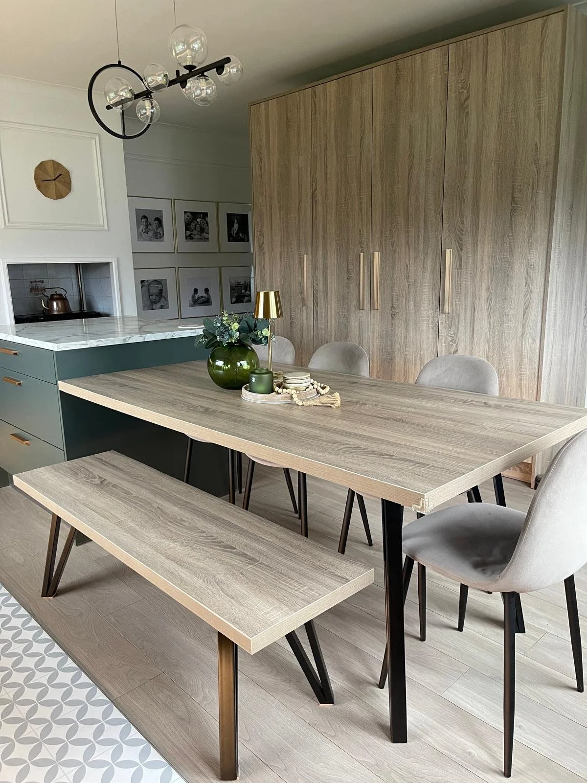Dining nook with a built-in bench, textured wall finish, and a warm, gathered feel for family living.