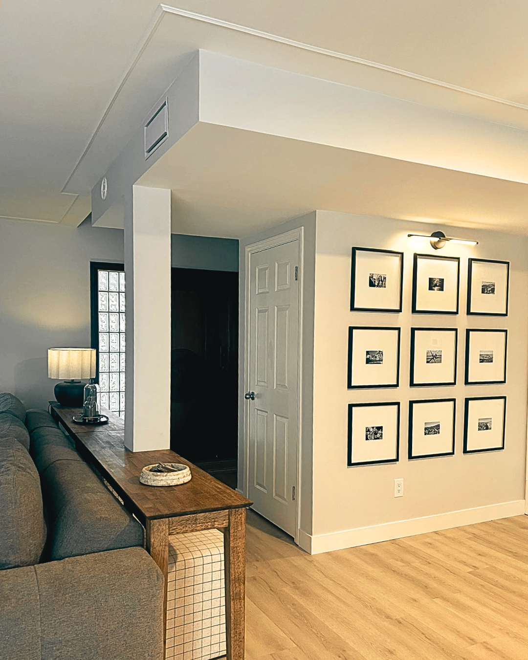 Hallway and living area with gallery artwork and better overall flow.