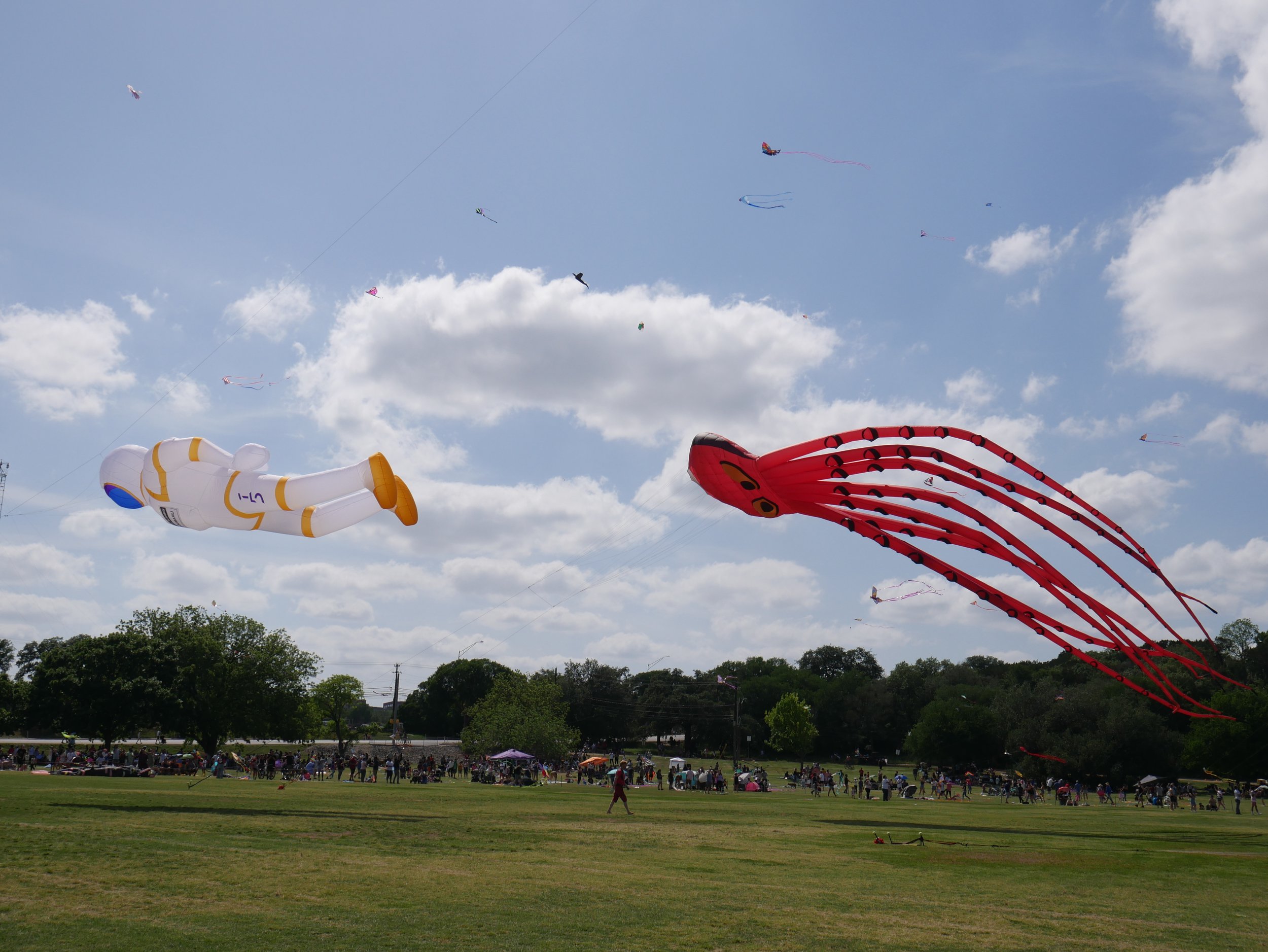  Giant astronaut and squid kites are flown by the Go Big Or Go Home kite group at the Kite Festival, Sunday, April 14, 2023, at Zilker Park in Austin, Texas. 