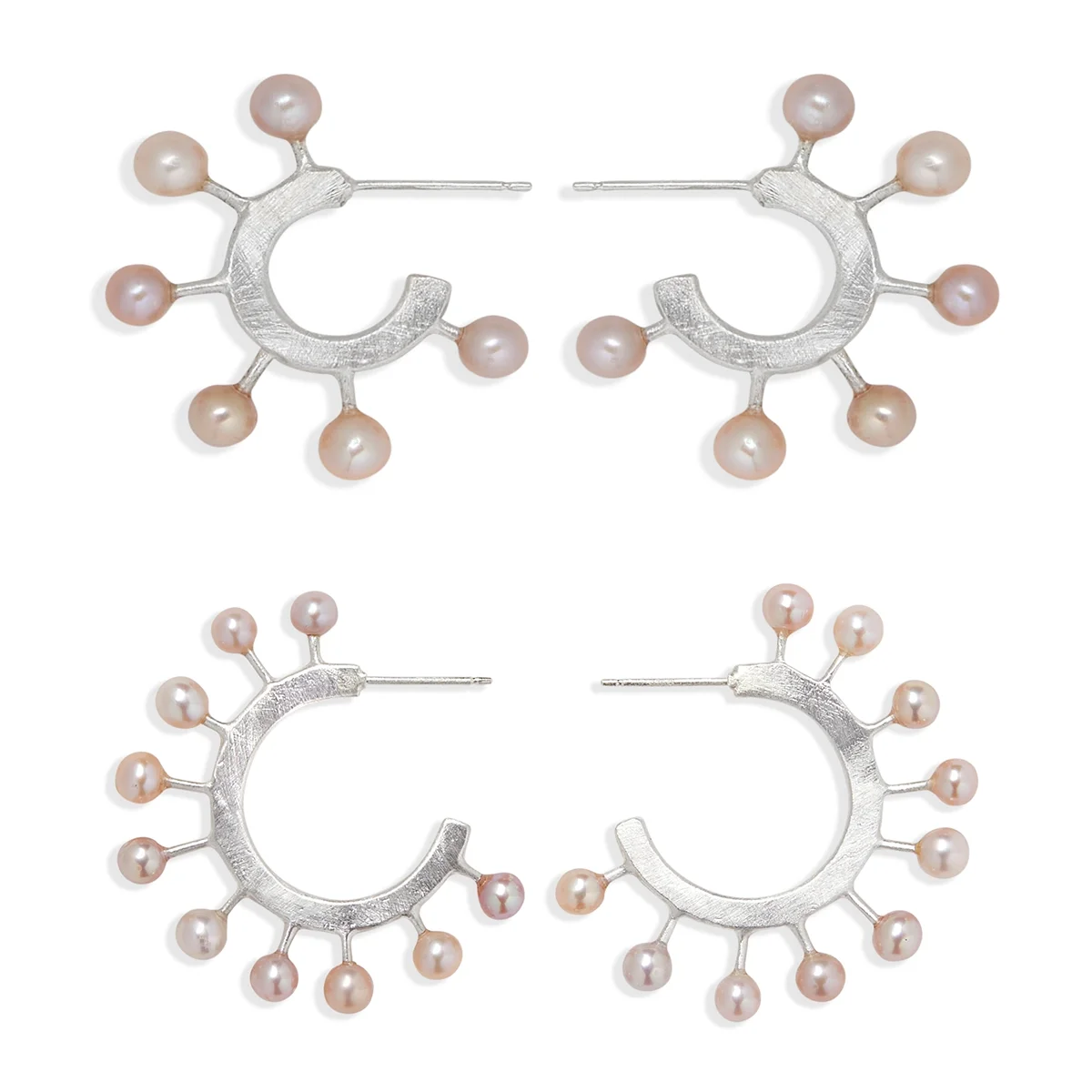 small and medium size pink pearl and sterling silver hoop earrings next to each other to show size
