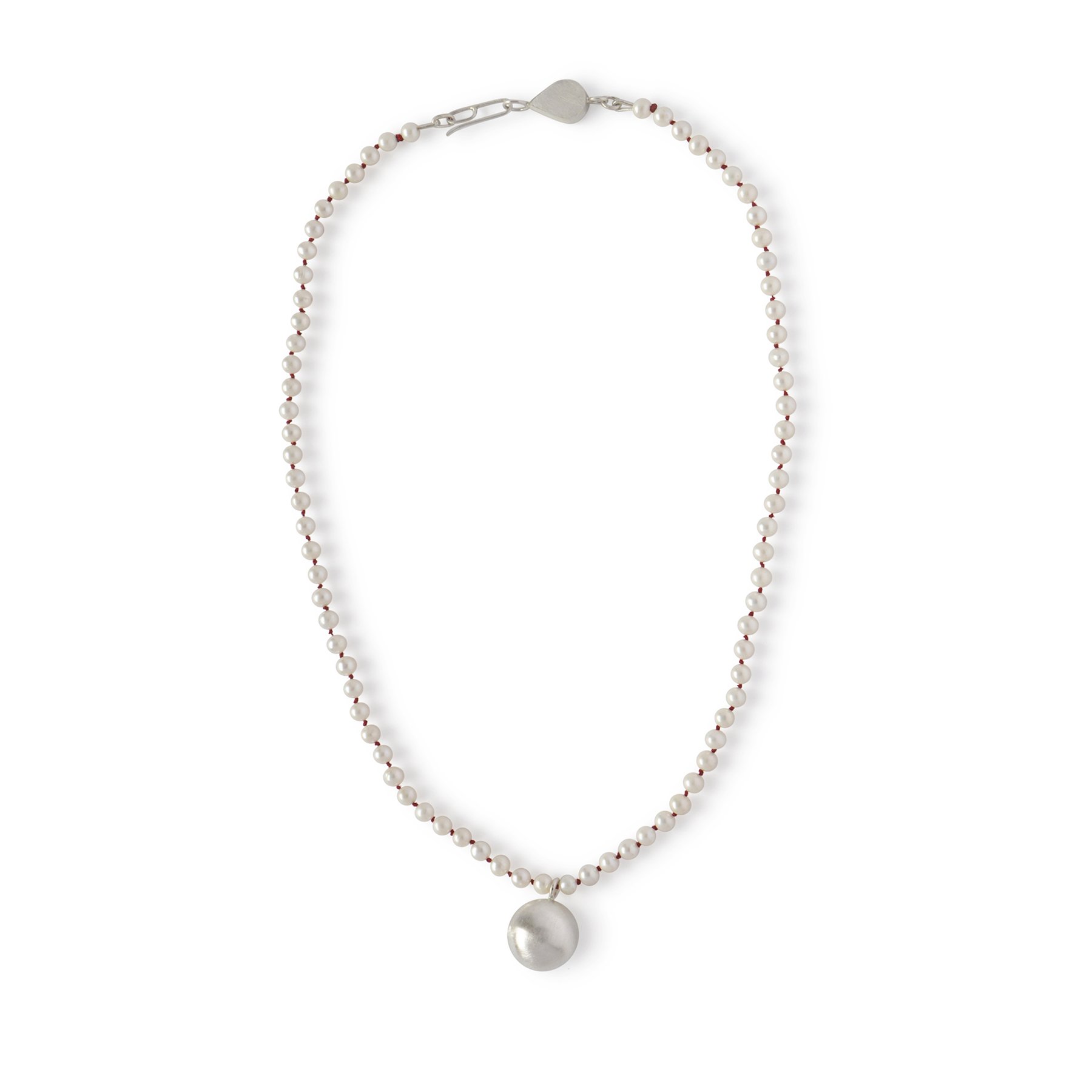 white freshwater pearl necklace knotted together with red silk thread and a custom sterling silver clasp and brushed sterling silver ball
