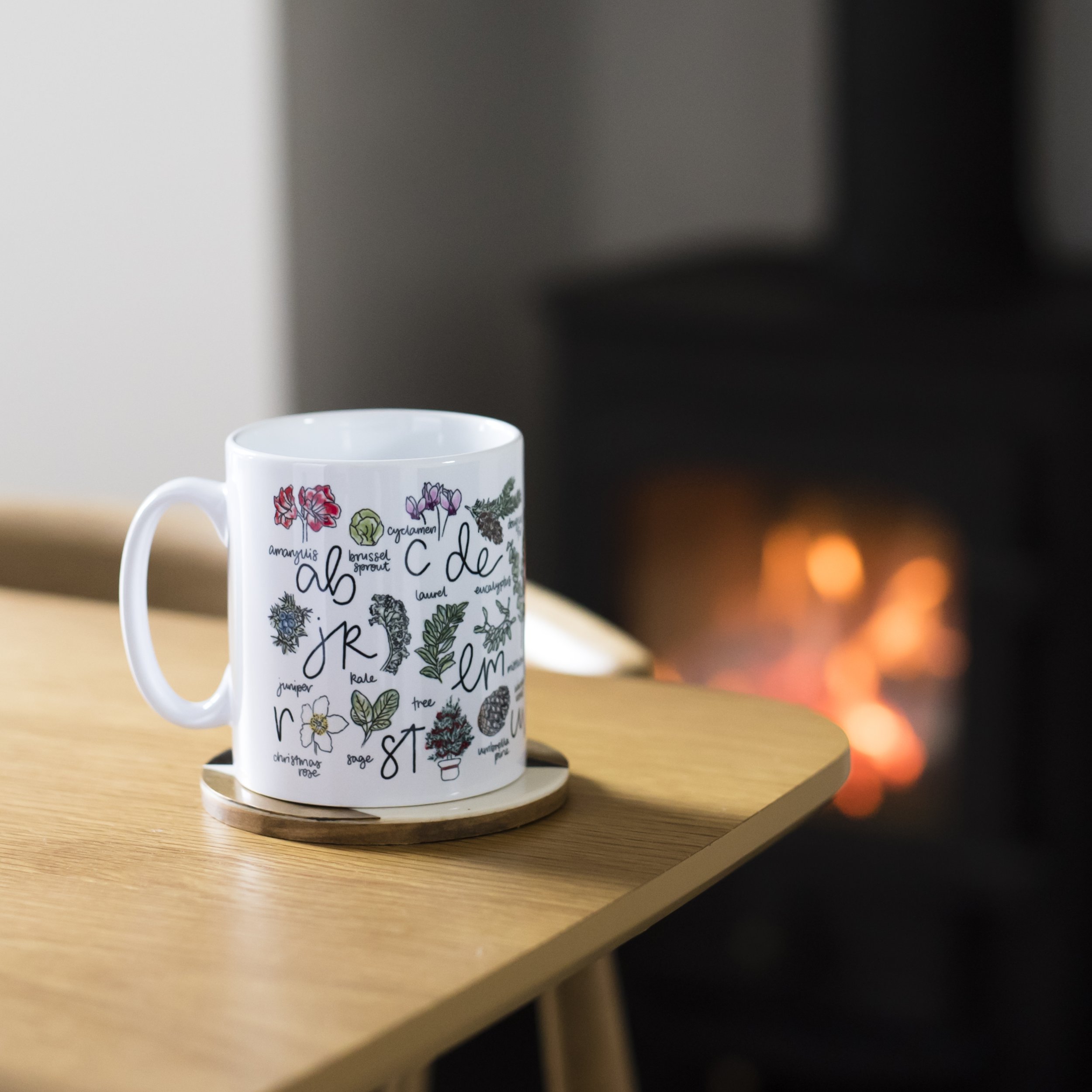 Christmas mug in front of fire - DaphneRosa.jpg