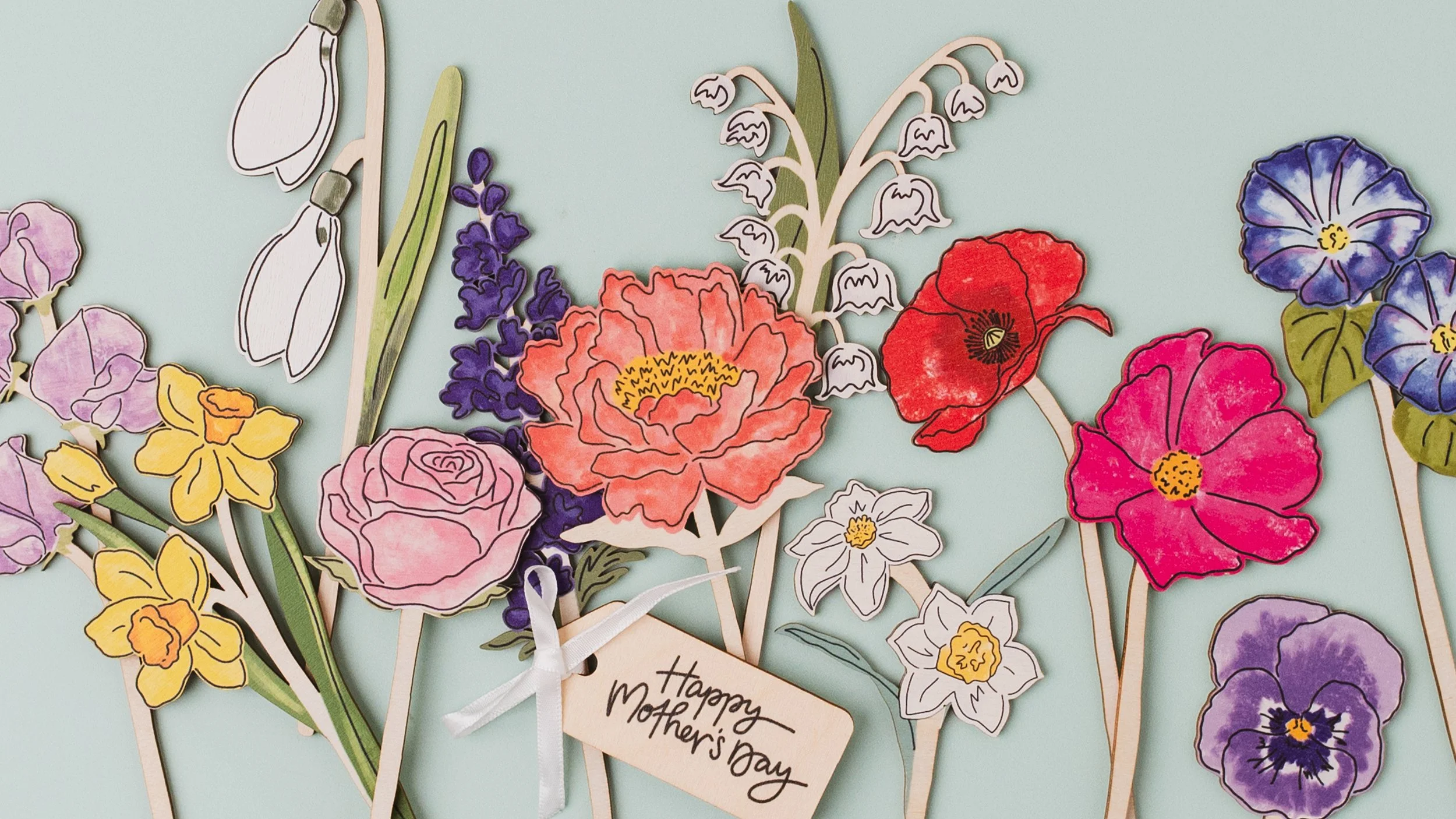 Array of wooden flowers with Happy Mother's Day wooden tag