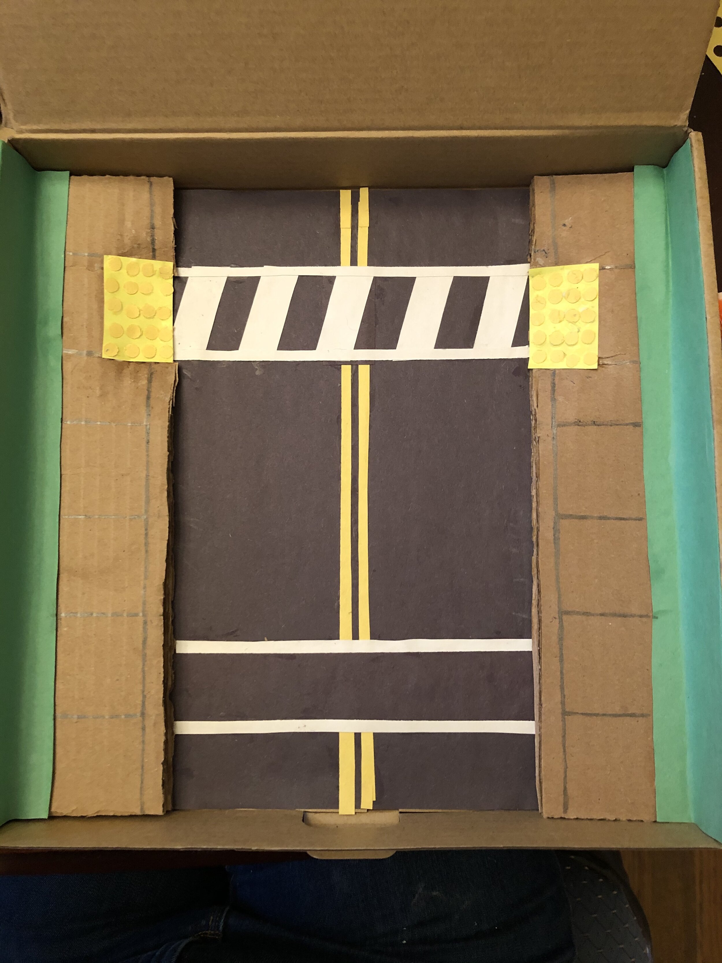 A Zebra Crosswalk with rumble strips is much easier to see.