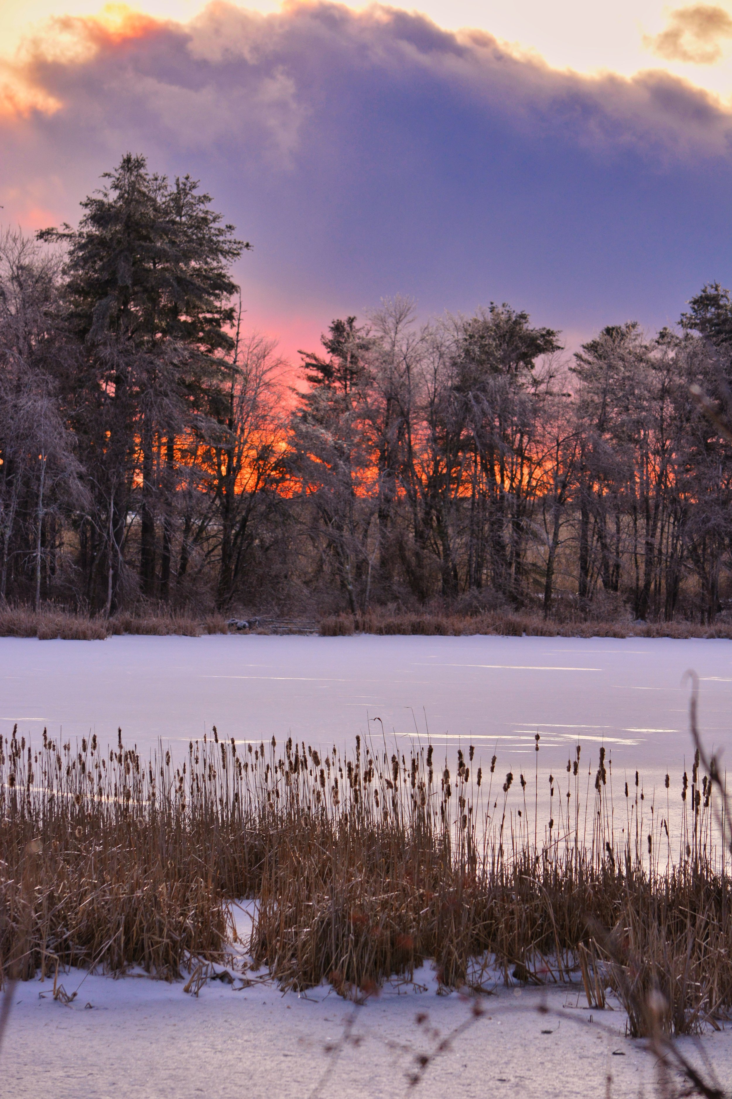 Winter Sunset Over Frozen Lake