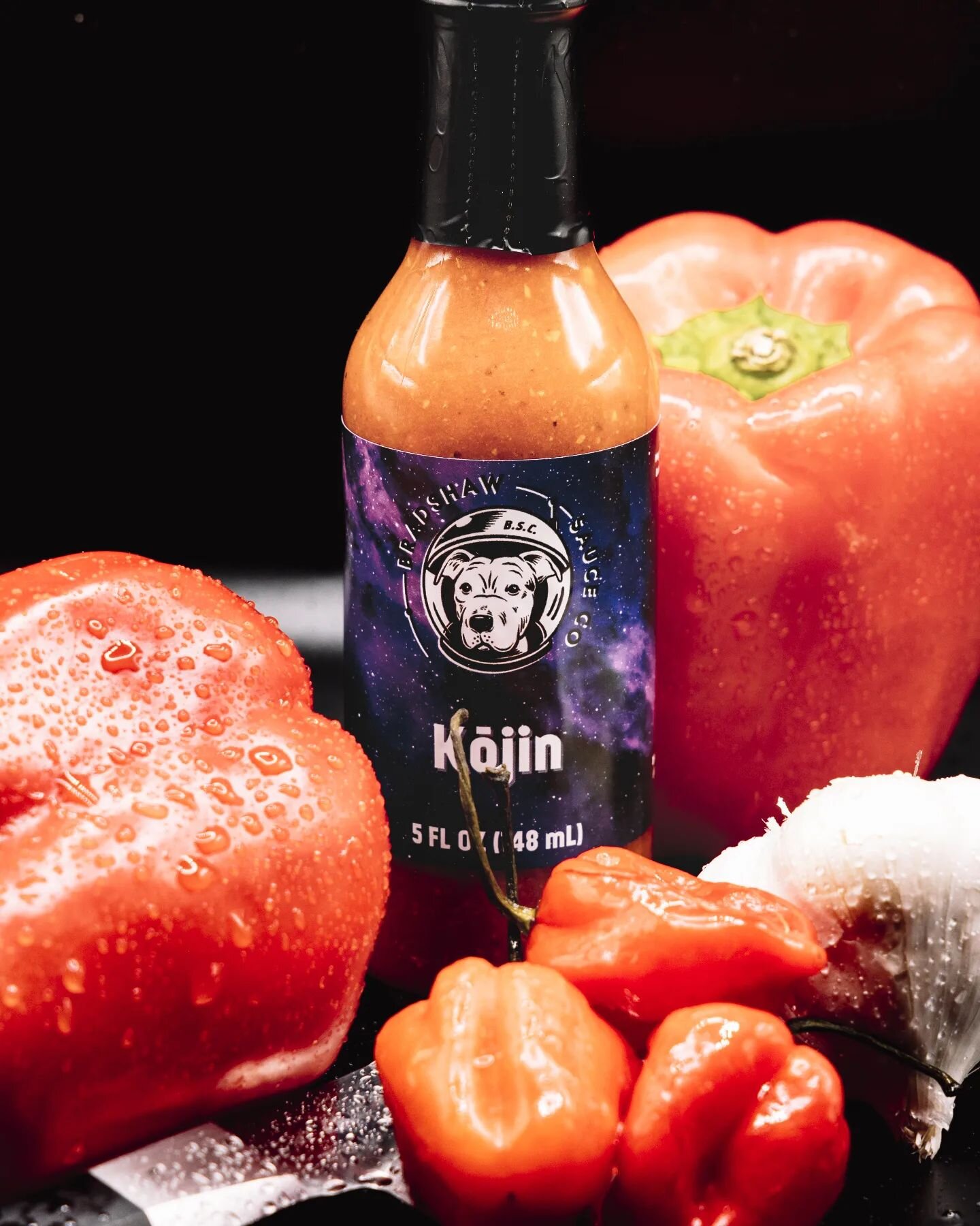 💥 Restocked: Kōjin 💥 Named for the Japanese God of fire and the kitchen, this sauce was once the hottest offering from Bradshaw Sauce Co. Lighting the fire with an abundance of roasted red savina habaneros paired with roasted garlic and cumin, this