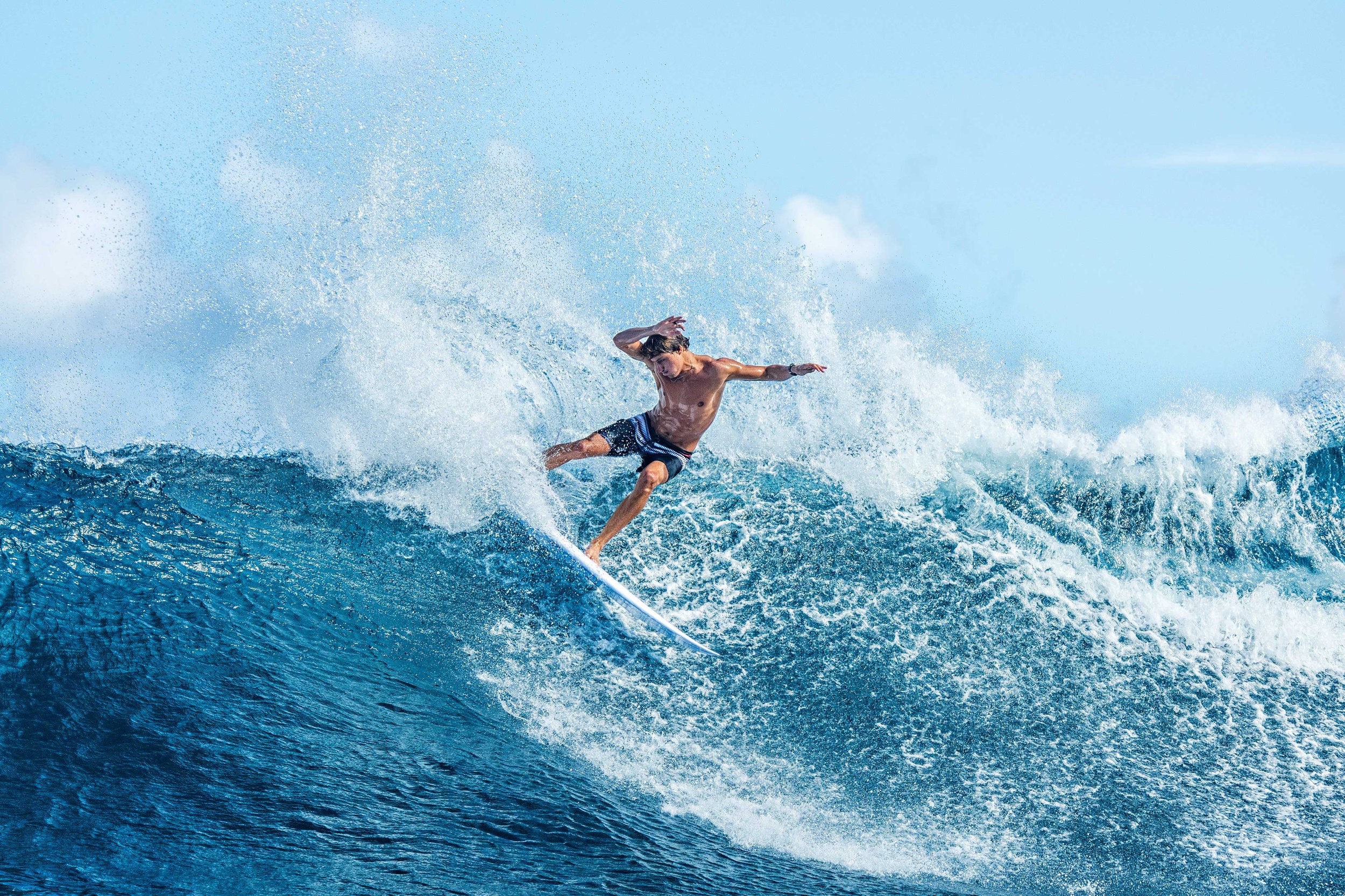 Surfer turning on a wave