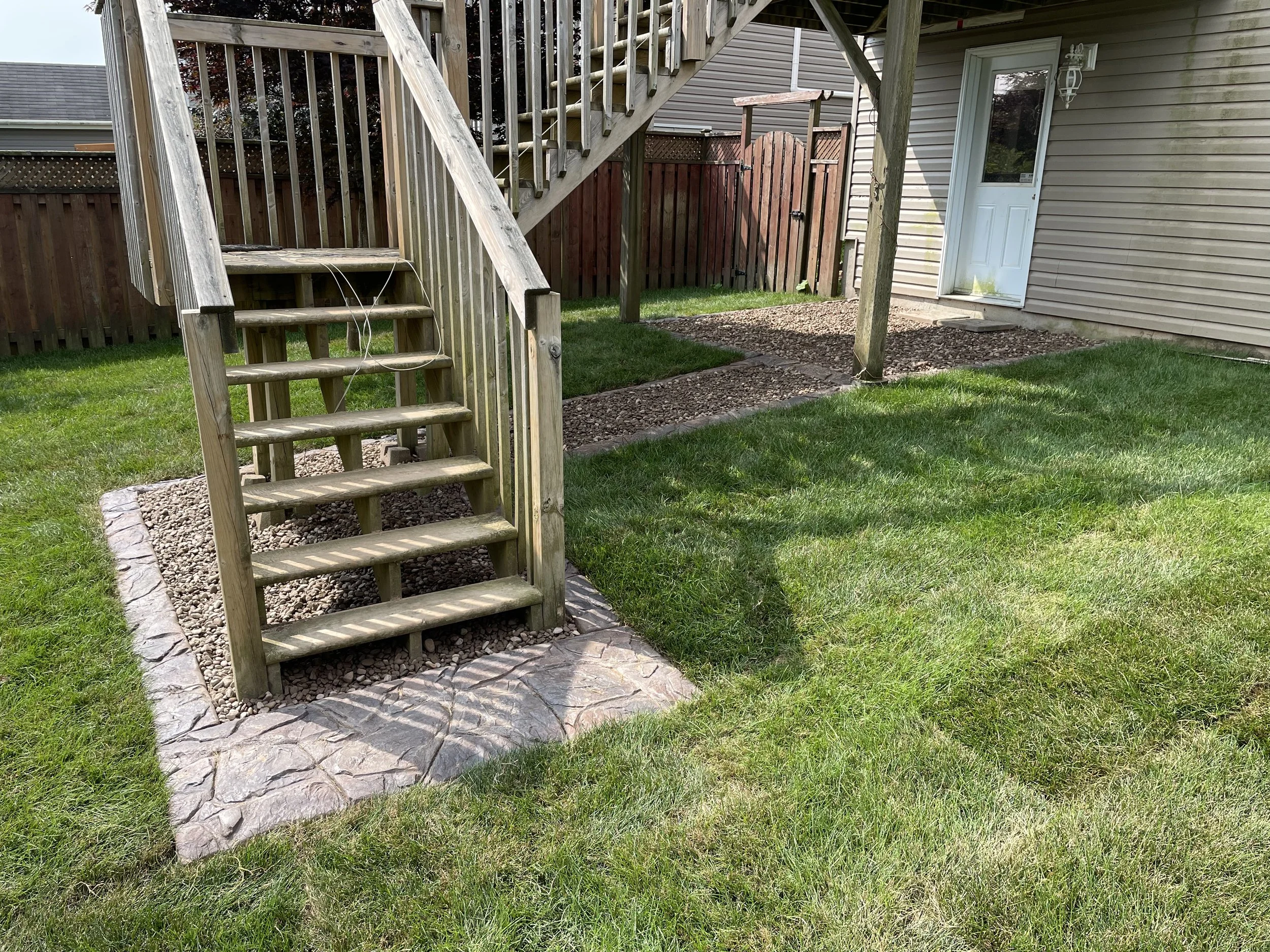 Property 1 - back yard deck stairs view after.jpg