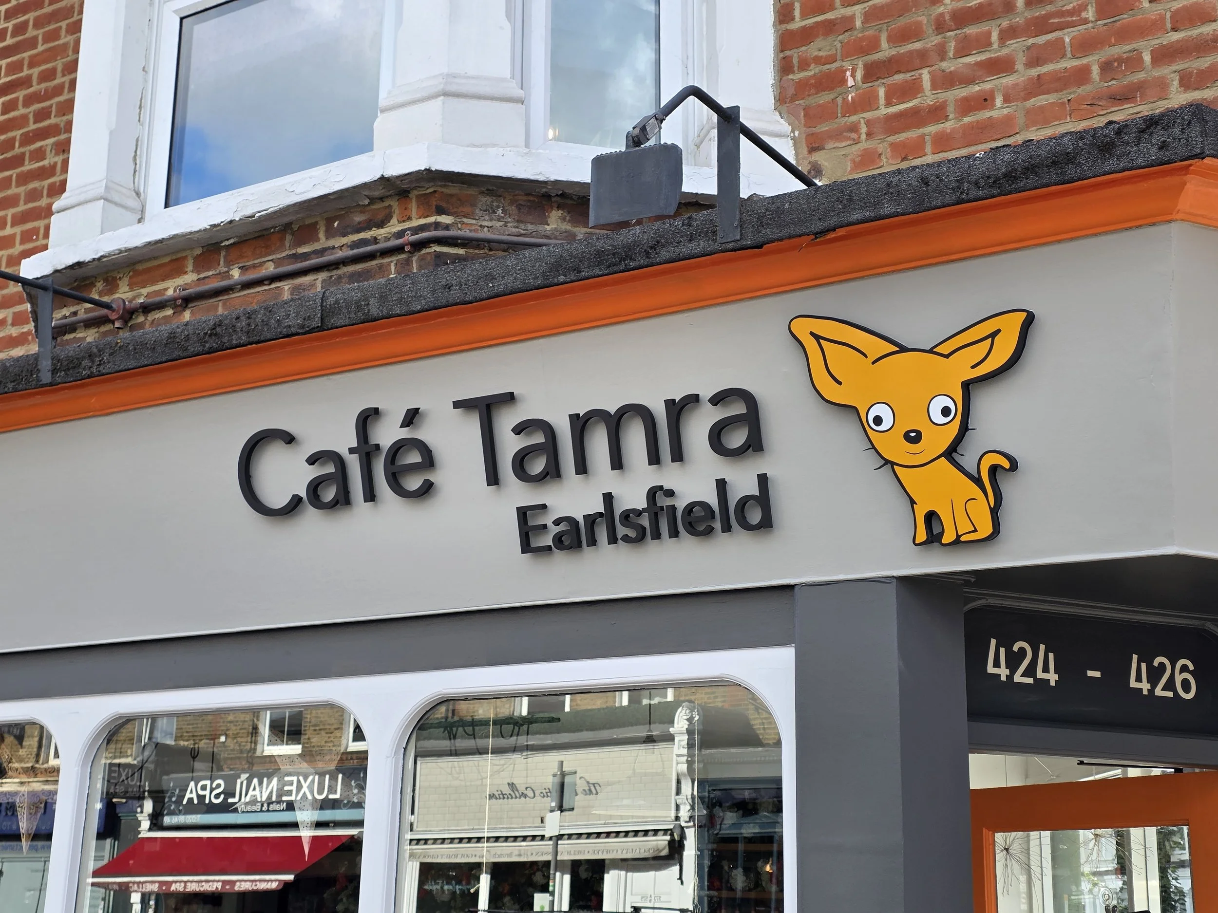 Sign for Café Tamra Earlsfield, an independent neighbourhood café in Wandsworth known for Mediterranean and Middle Eastern inspired brunch
