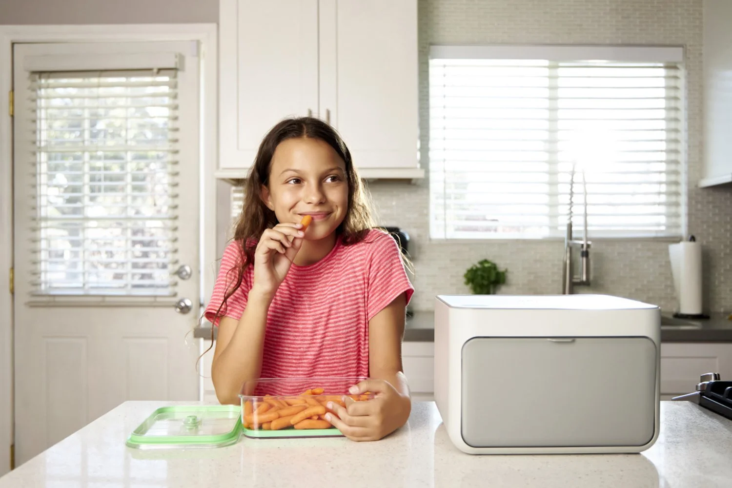 Professional lifestyle product photography featuring a young girl enjoying a healthy snack.
