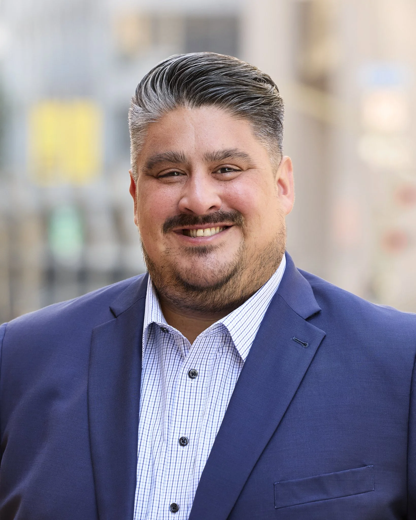 Professional headshot featuring Christopher Guerrero in downtown Los Angeles, CA.