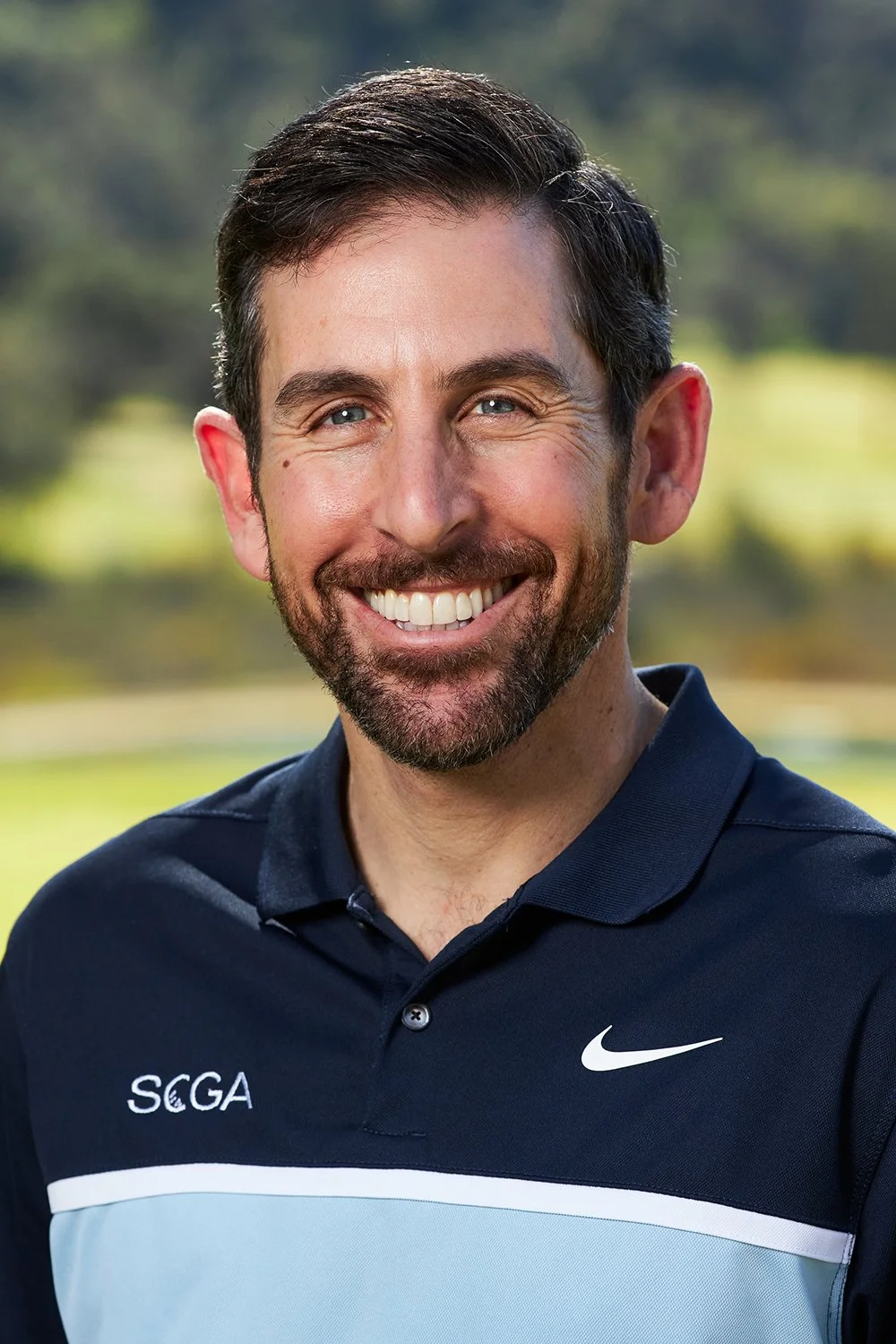 Professional corporate headshot featuring an employee of SCGA.