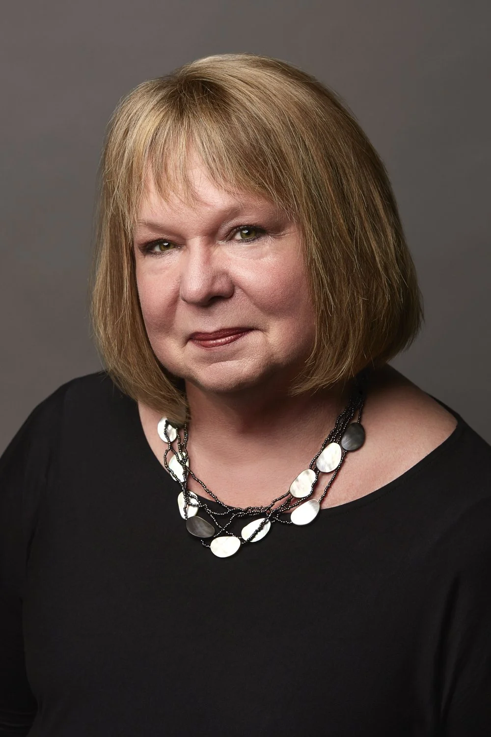 Professional headshot featuring my mom.