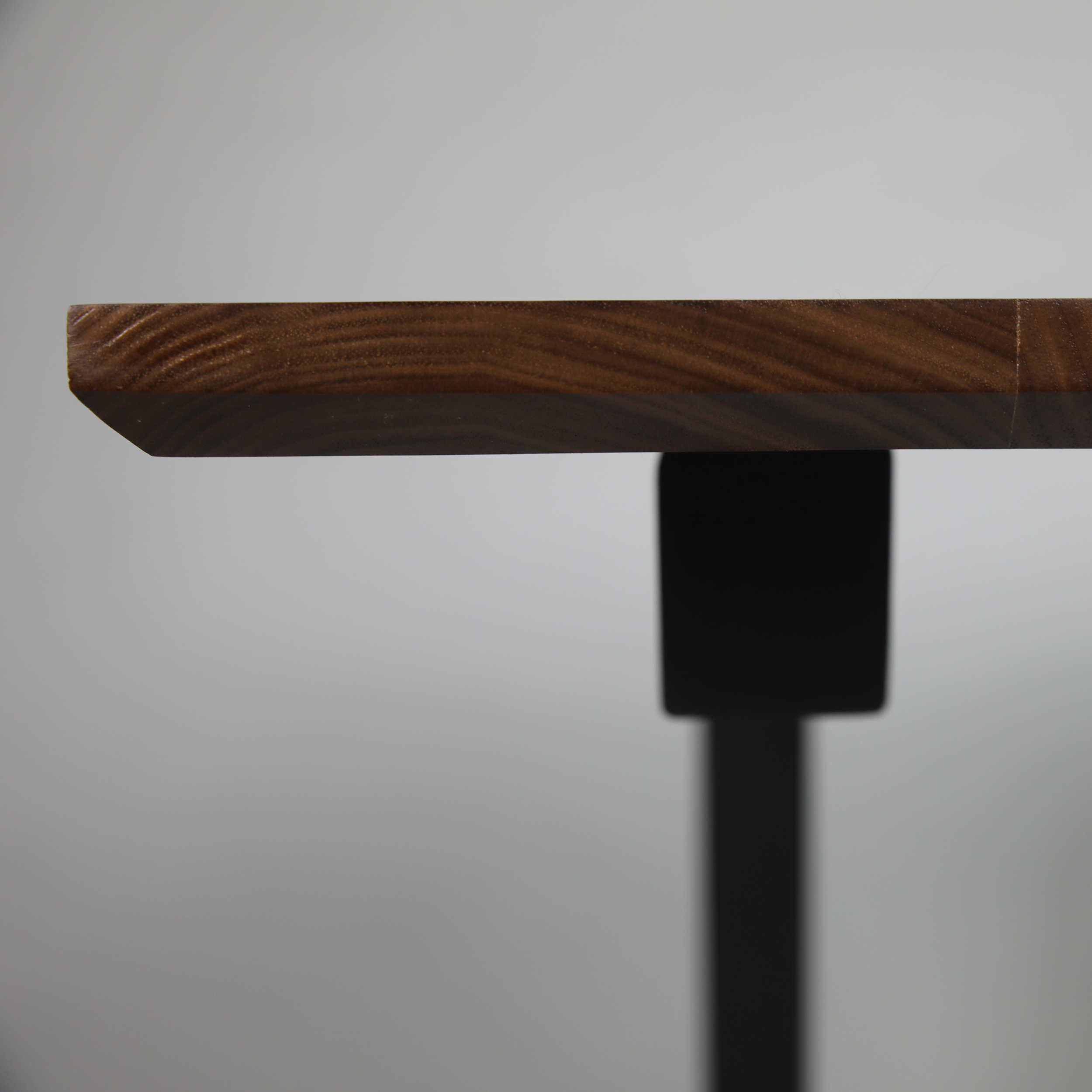 Flathead-C-Table-Walnut-Front-Close-Up.png