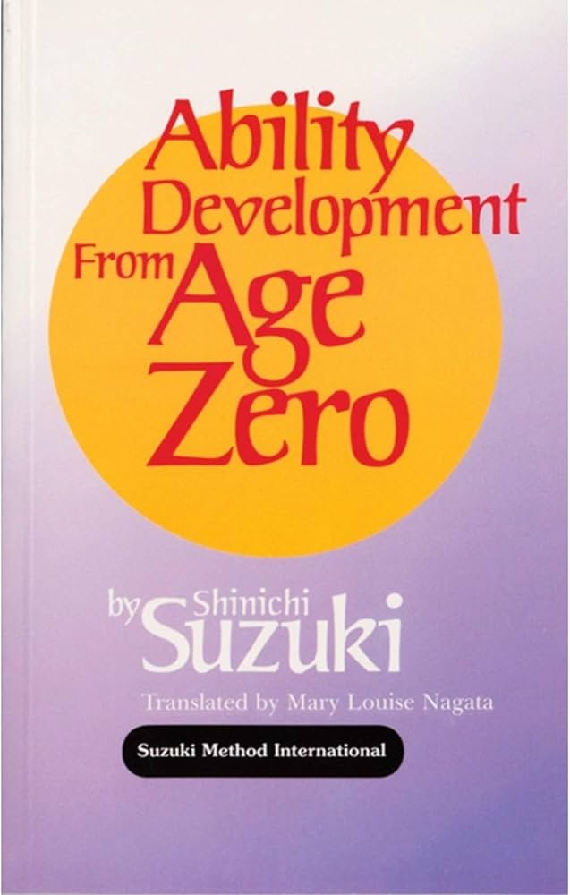 A book cover with the words "Ability Development From Age Zero by Shinichi Suzuki, translated by Mary Louise Nagata, published by Suzuki Method International."