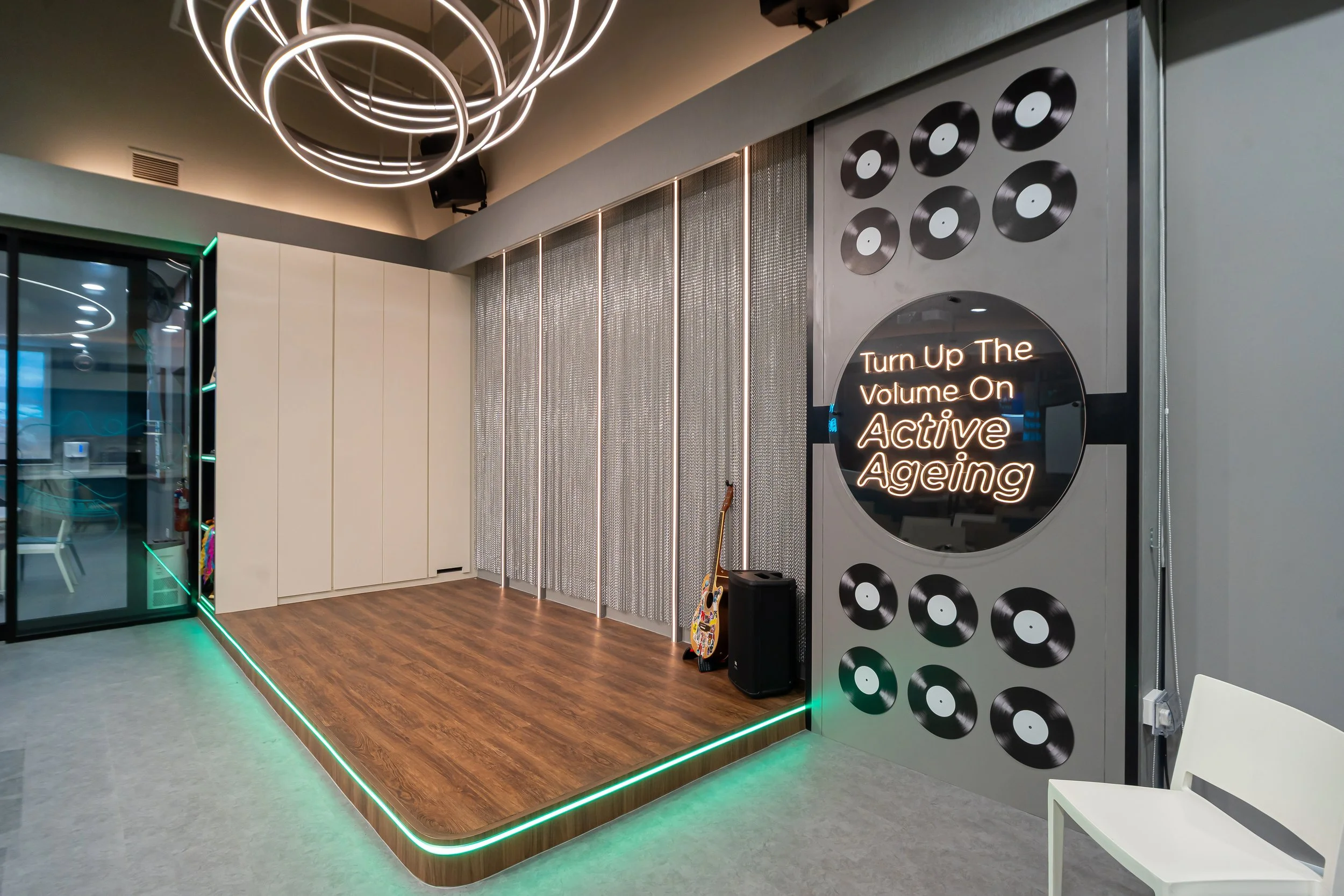 NTUC Health Active Ageing Centre @ Bukit Panjang with Records motif and neon lettering for that nostalgic ambience