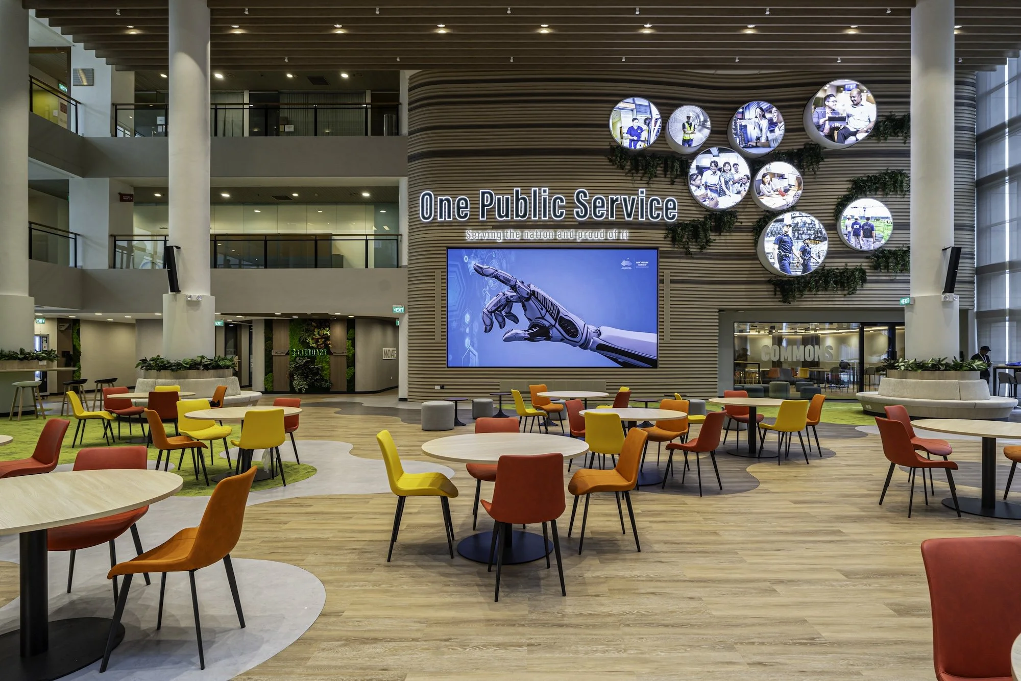 The redesigned dramatic wall in zen colours facing off the original blue facade in the Civil College Service atrium