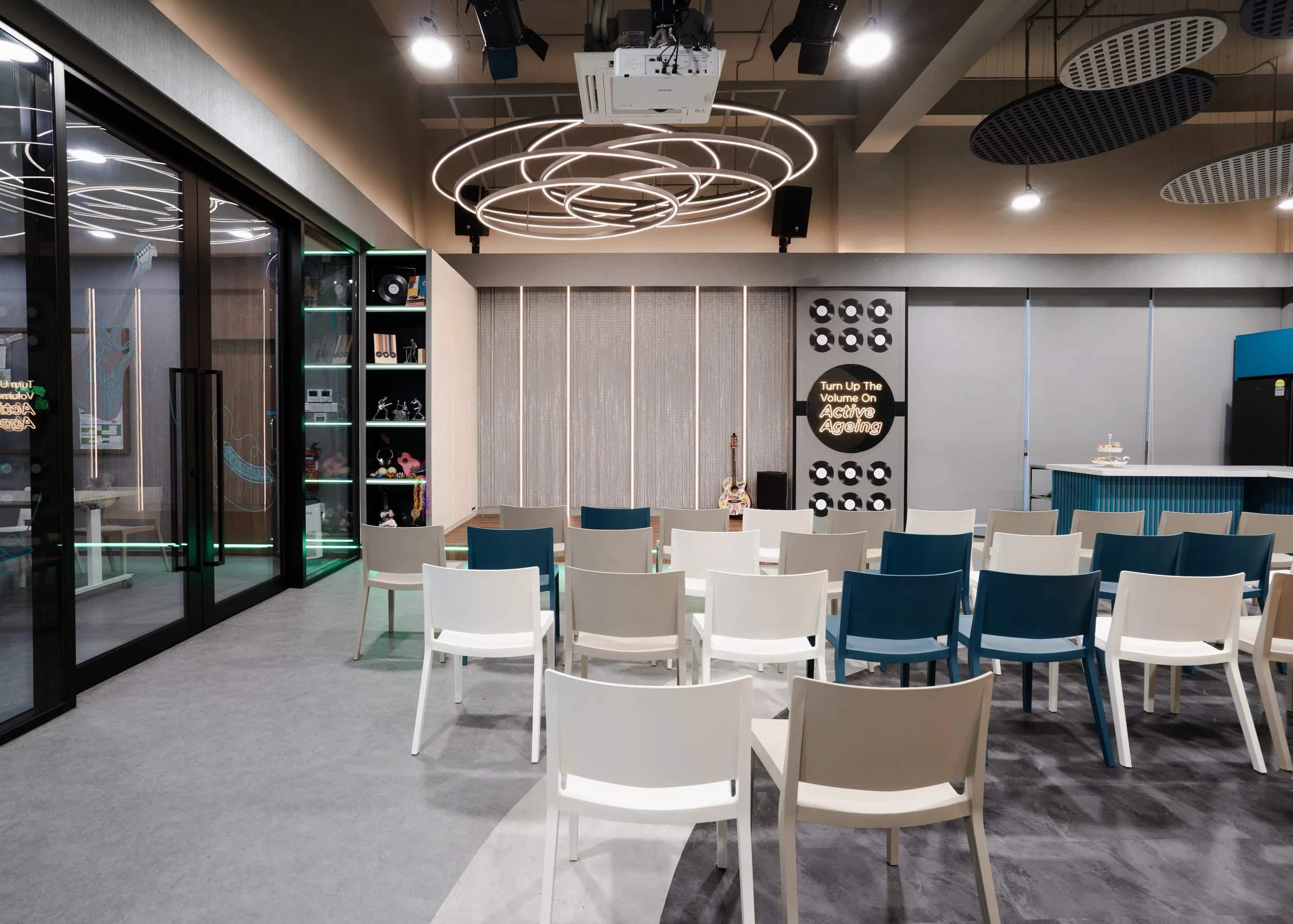 NTUC Health Active Ageing Centre @ Bukit Panjang fitted with dramatic suspended lights over the Rockstar Stage