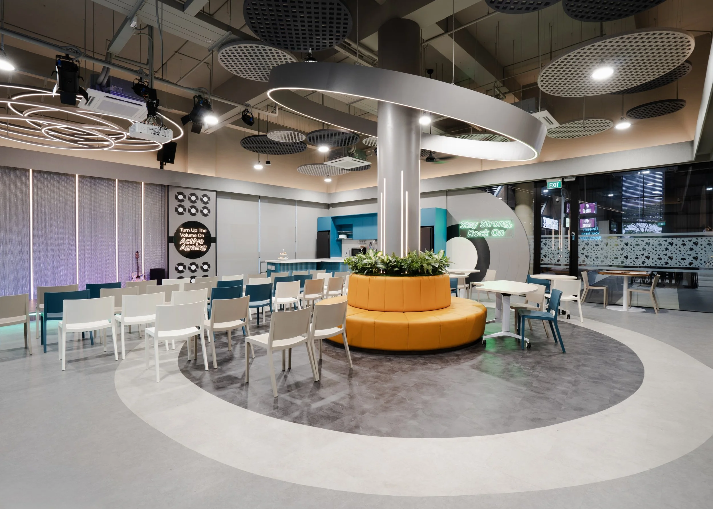 Cantilevered circular light around pillar at NTUC Health Active Ageing Centre Bukit Panjang