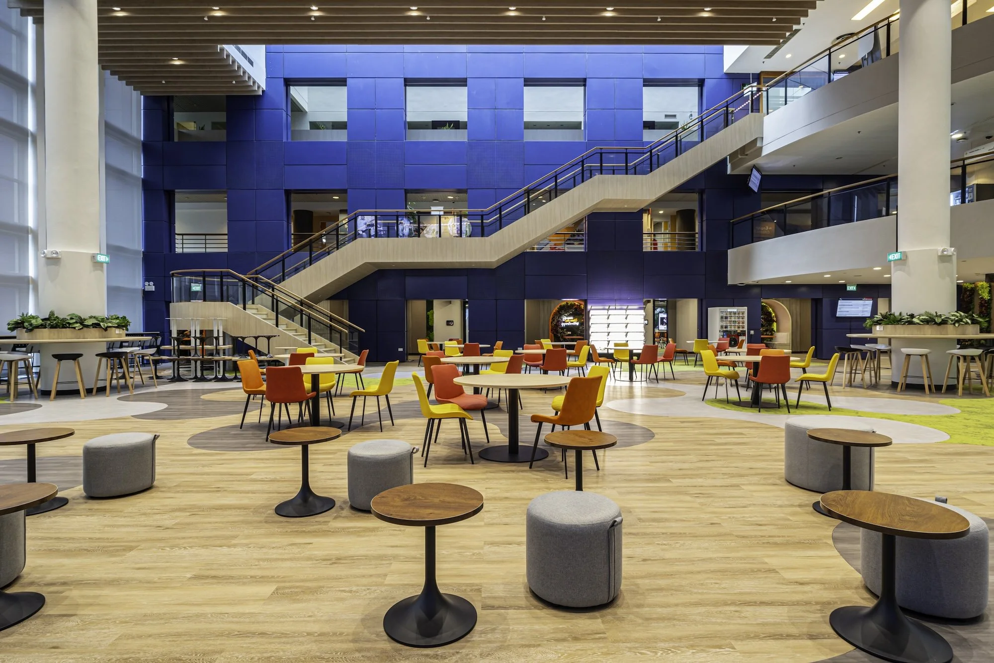 The Blue Aluminium Wall at the Civil Service College retained and refreshed with the addition of flexible furniture and bio-organic floor patterns