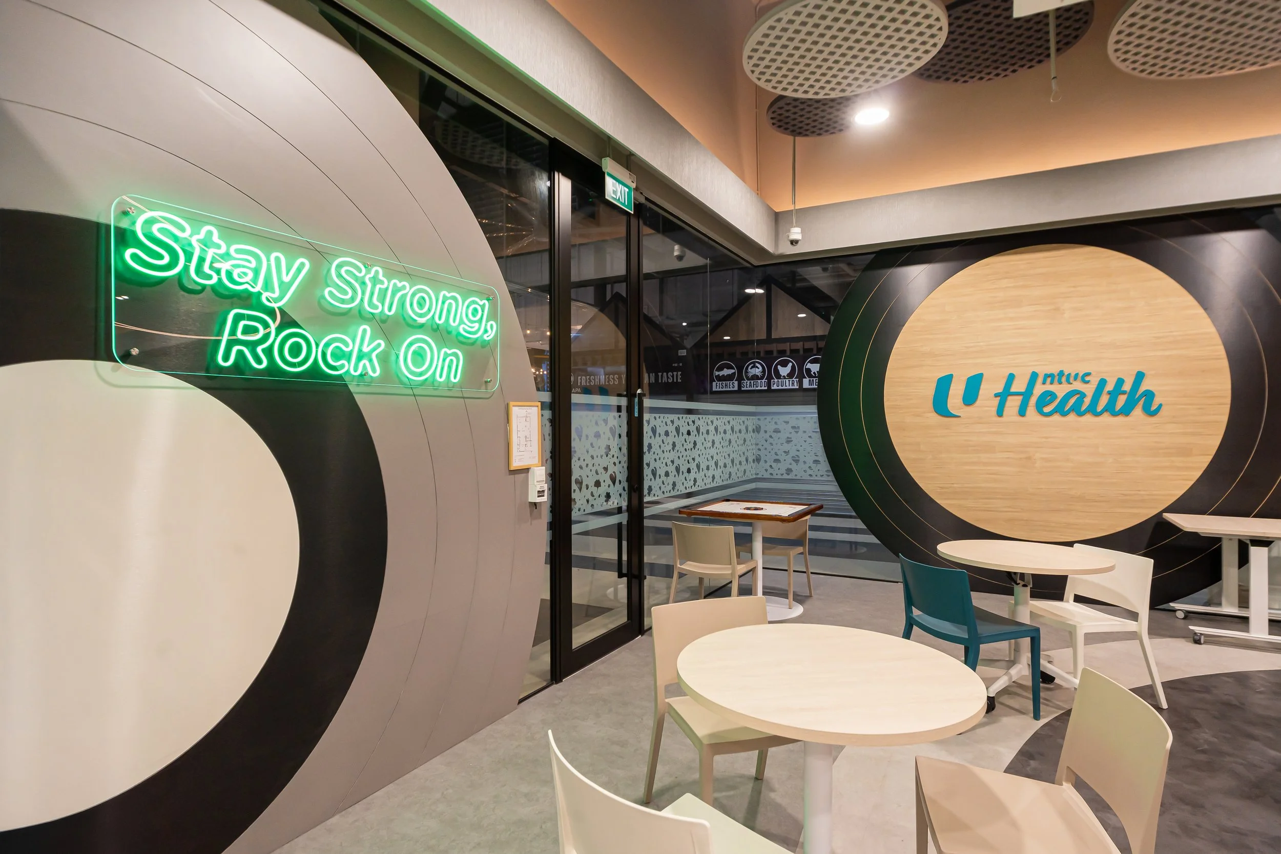 NTUC Health Active Ageing Centre @ Bukit Panjang with supersized Record motifs as privacy barriers