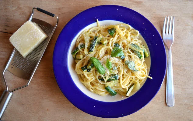 Spaghetti with zucchine, egg, Parmesan, and basil