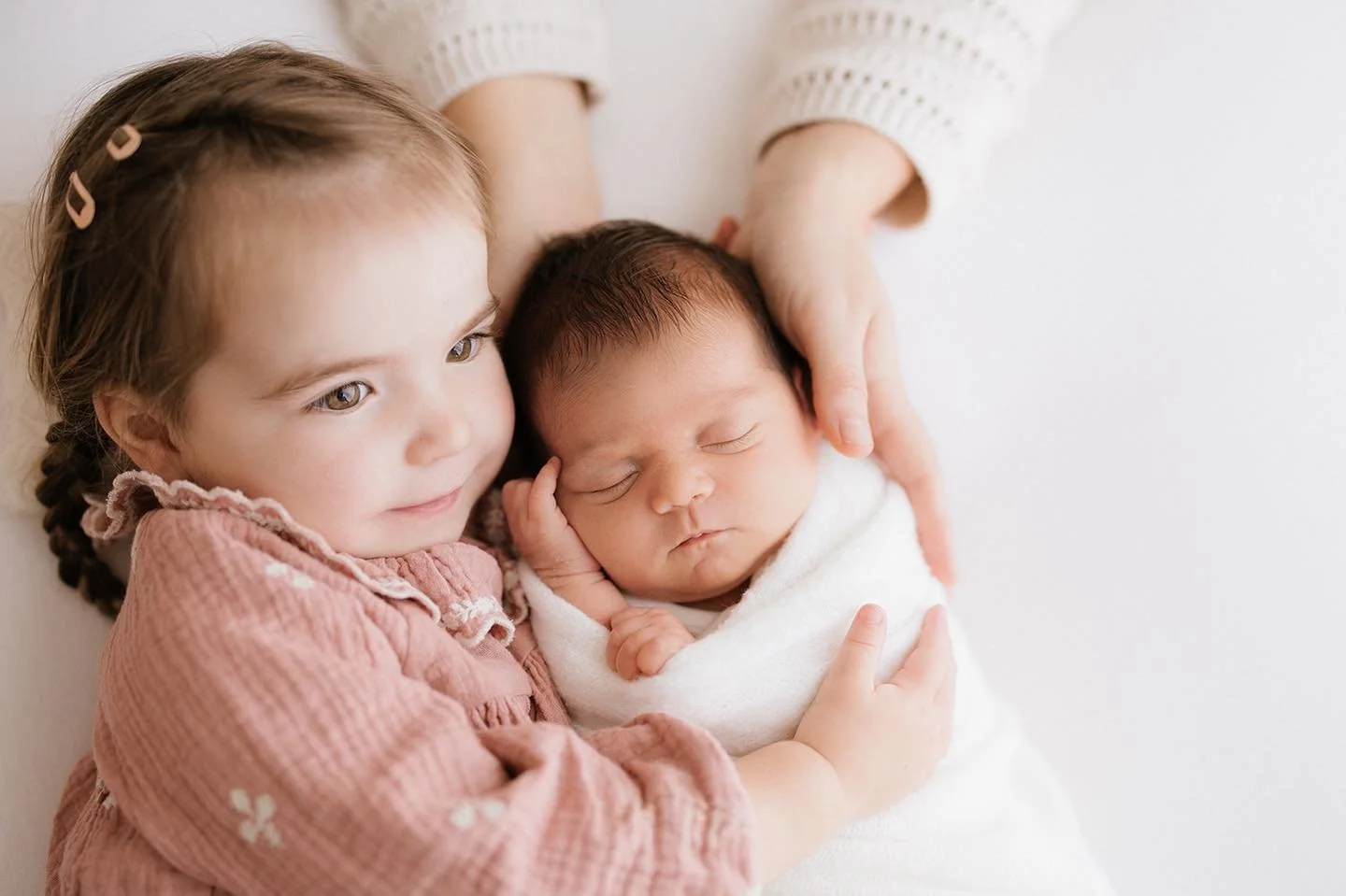 When your family makes the leap from one to two children, it feels like you've got the piece you never knew was missing. 

Everything doubles, most of all the size of your heart.

Get these memories captured. You'll be in safe hands. 

Newborn sessio