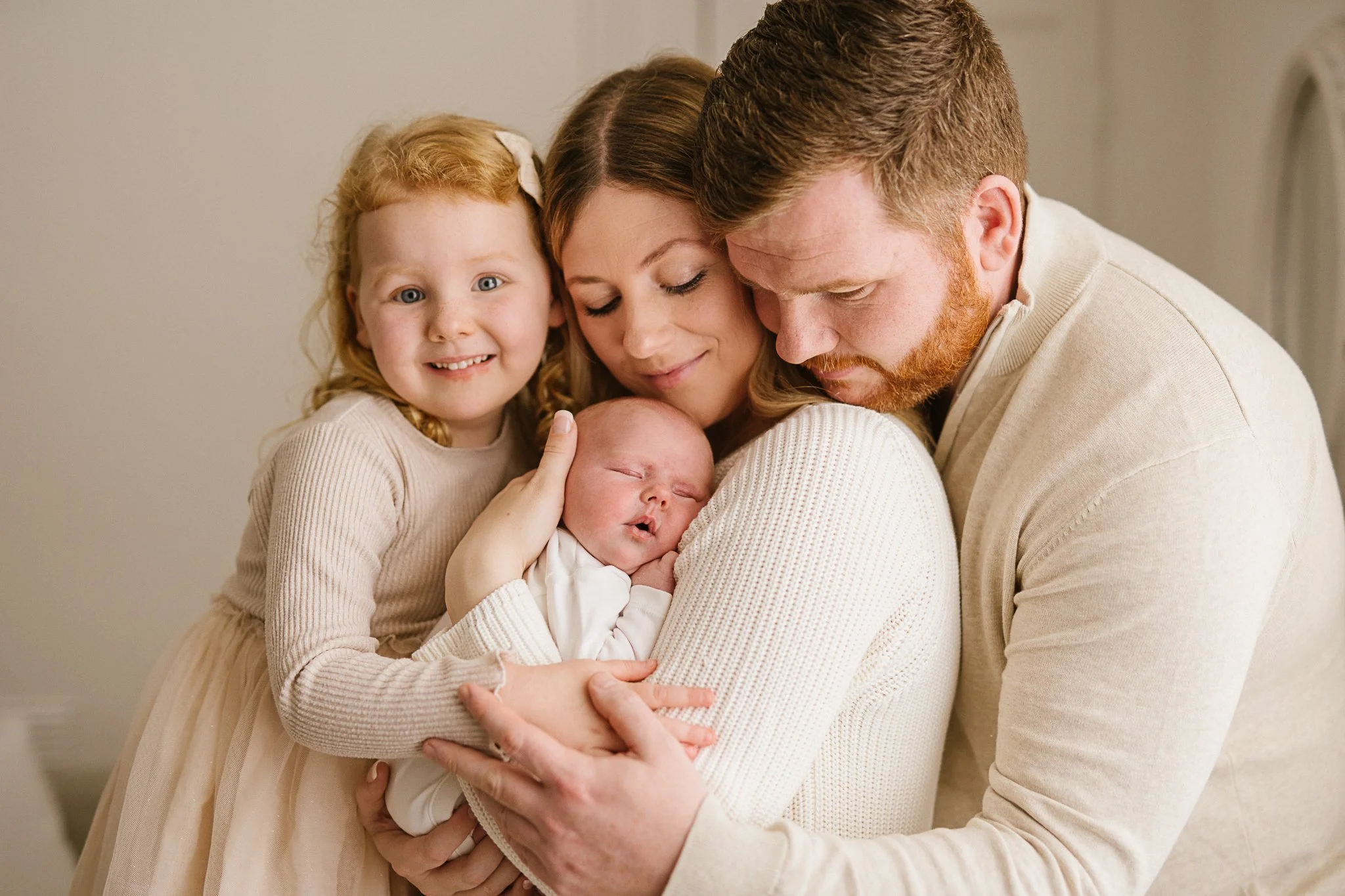Family together during newborn photoshoot In Cornwall